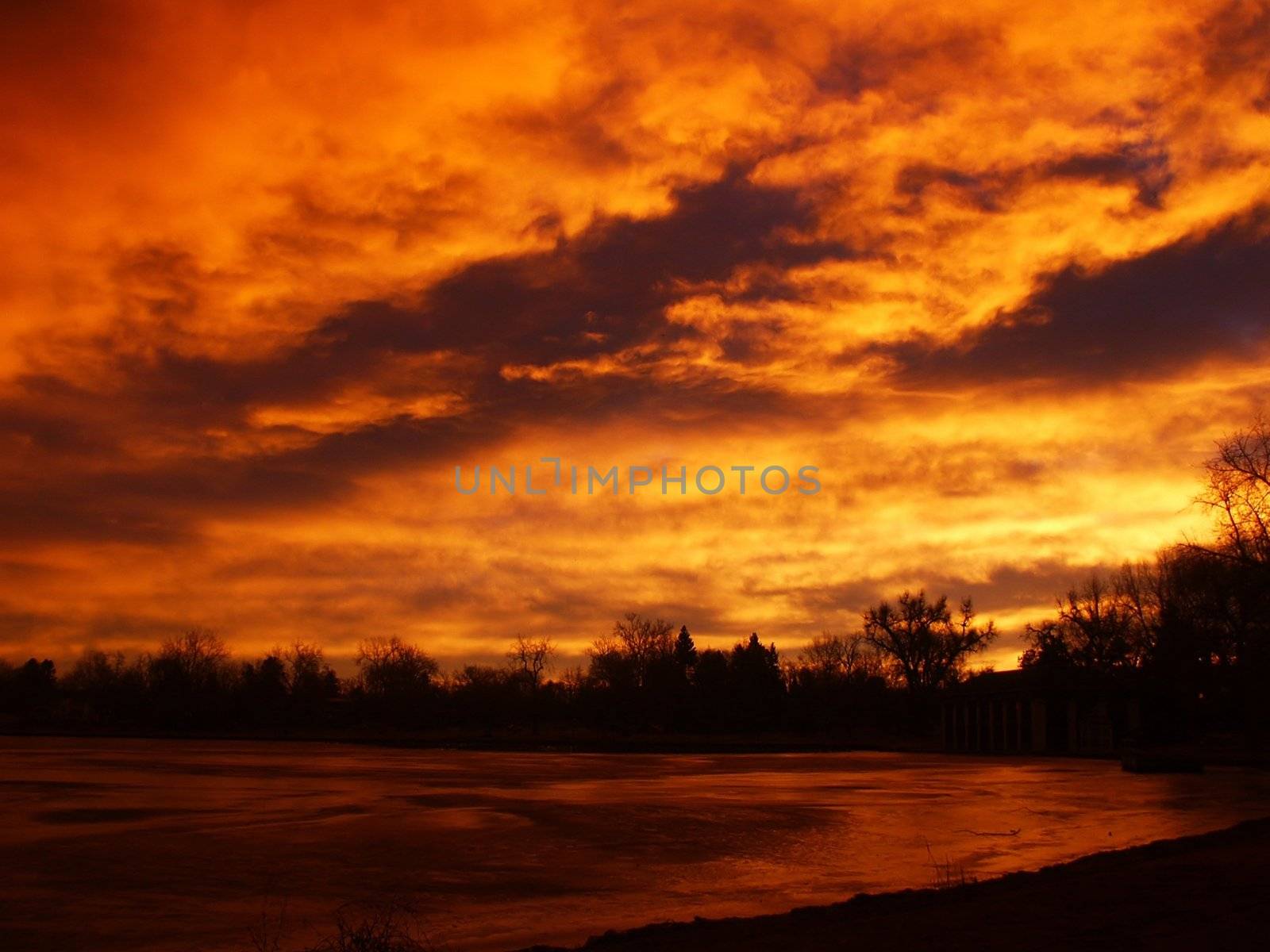 Fire Red Sunrise and a Lake by jdebordphoto