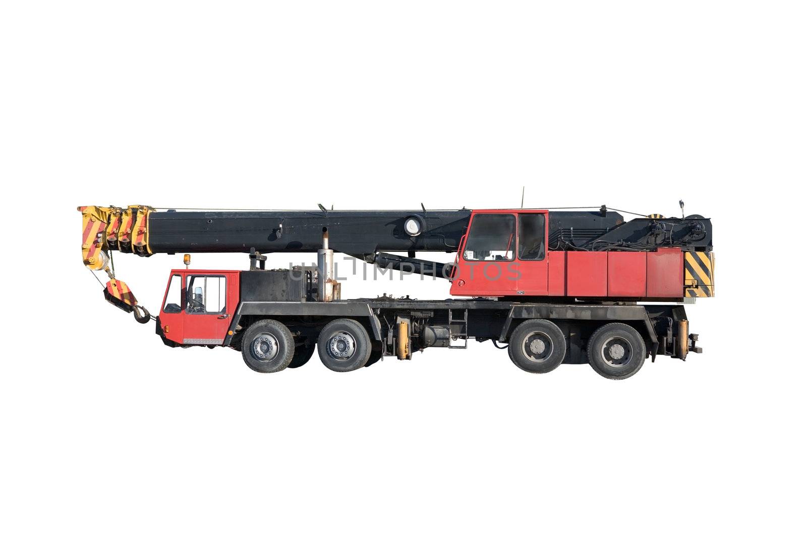 Mobile hydraulic truck crane in transport position isolated on a white background.