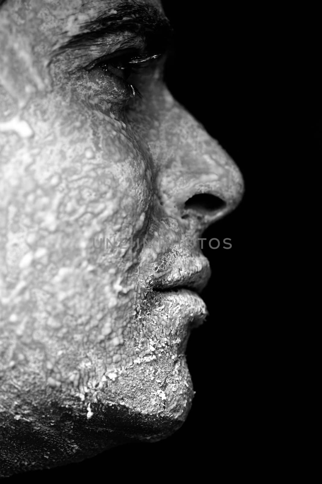 Close up view of a man looking with the face full of flour.