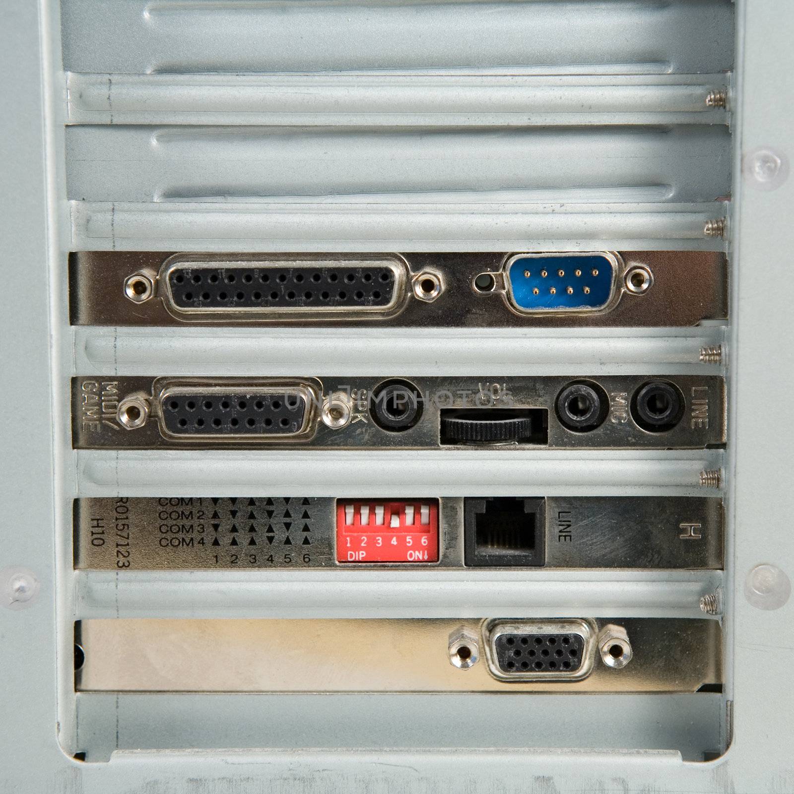 Card slots of a personal computer. Four cards installed, two slots free.