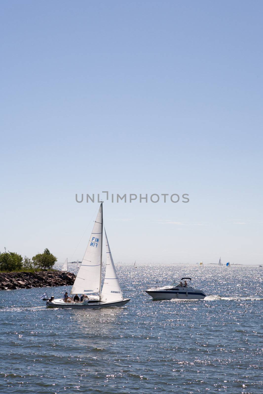 Sailboat vs. Motorboat by Luminis