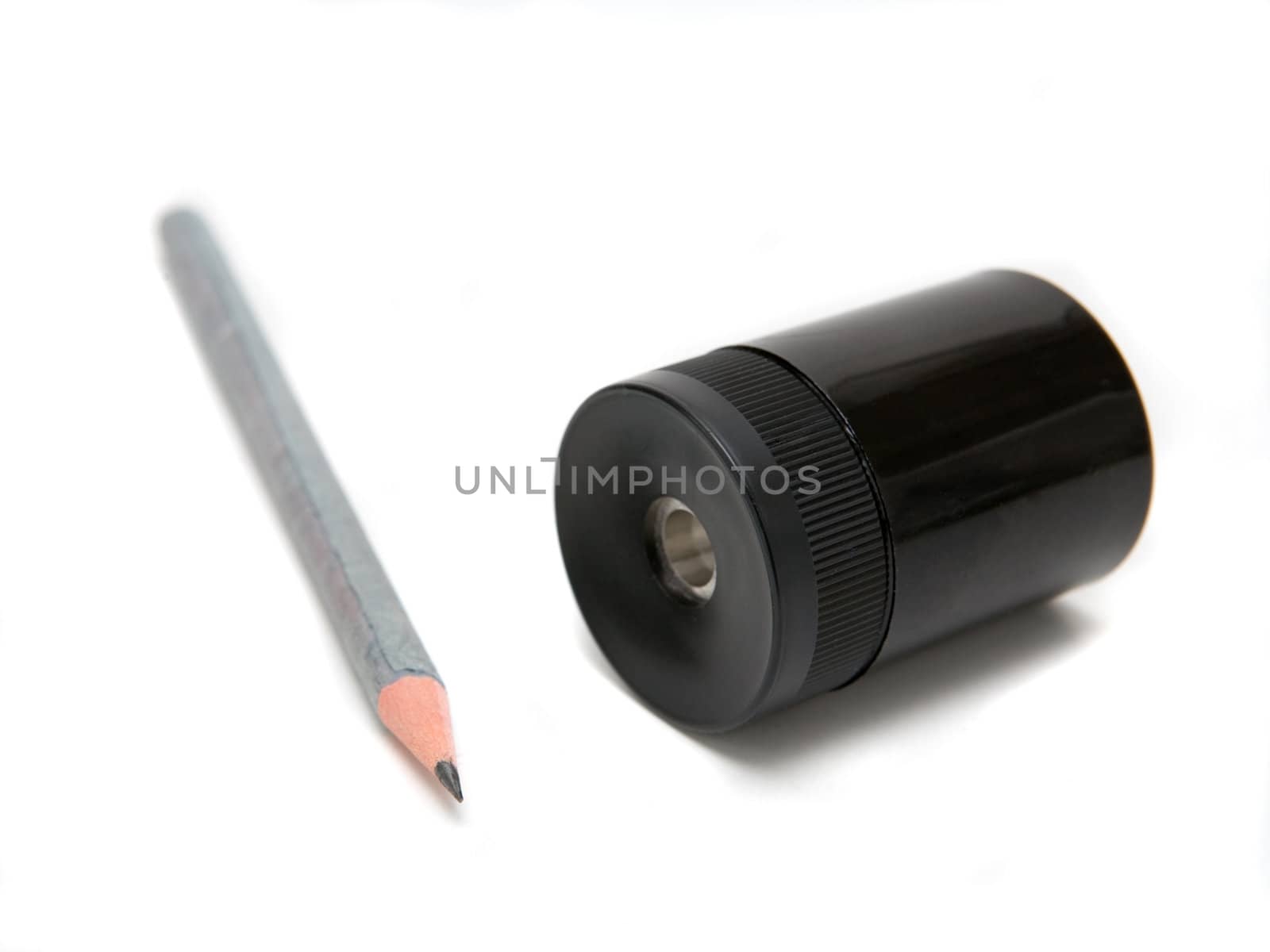 Sharpener and pen on a white background