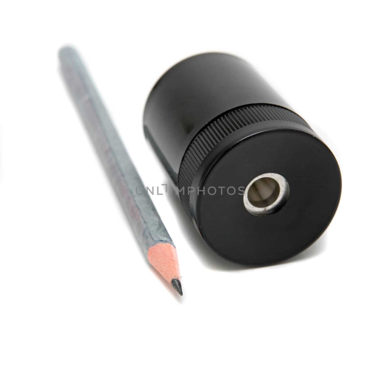 Sharpener and pen on a white background