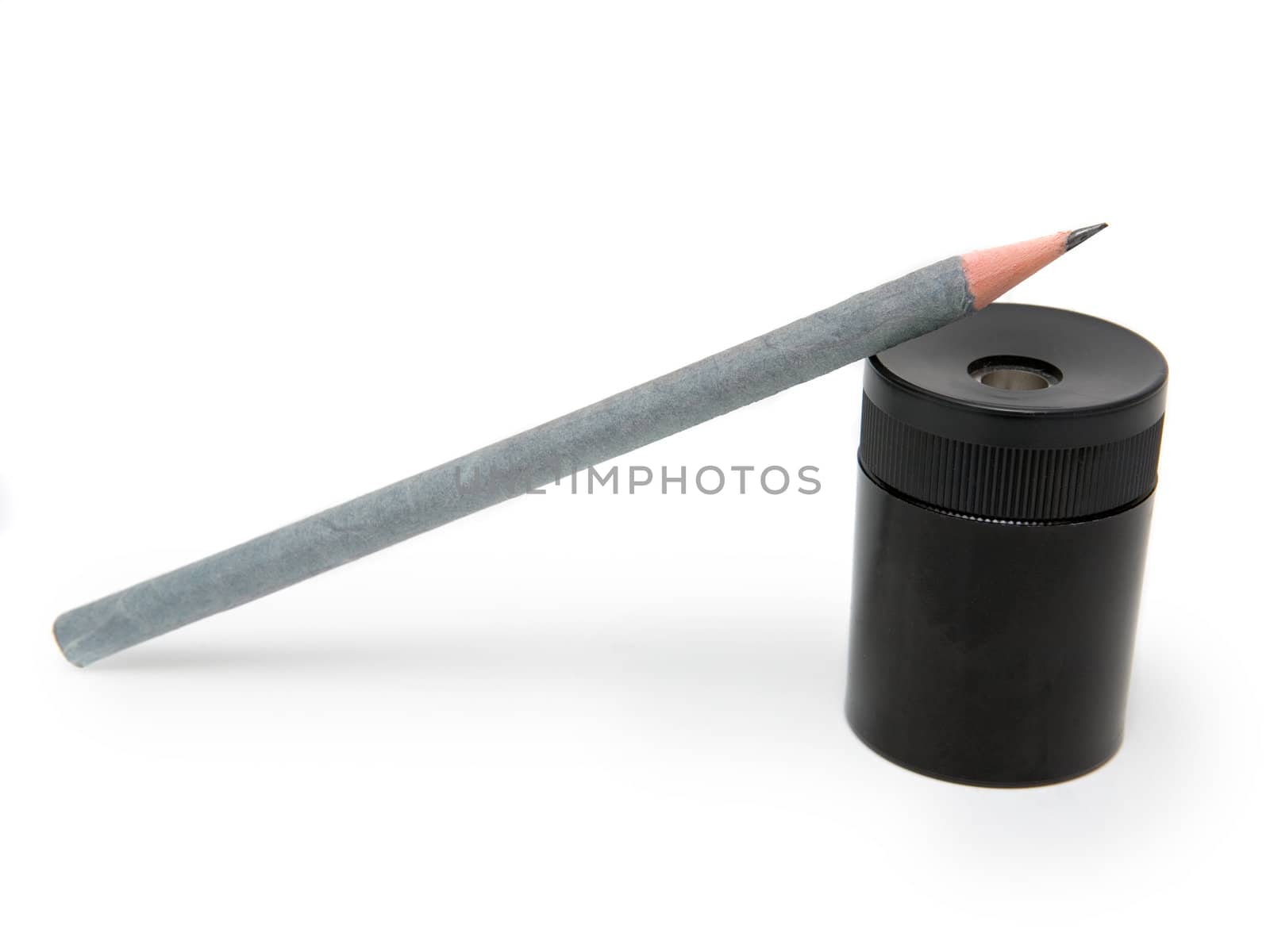 Sharpener and pen on a white background