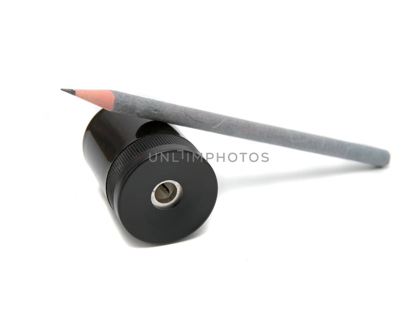 Sharpener and pen on a white background