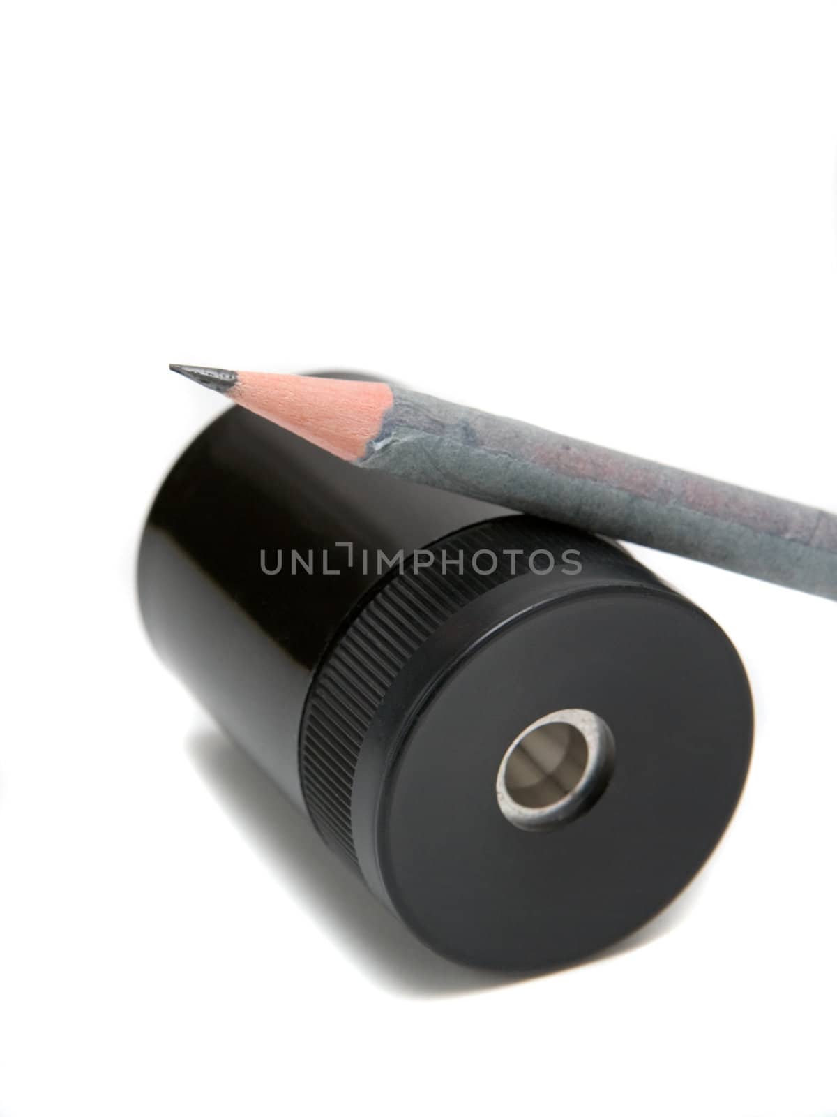 Sharpener and pen on a white background