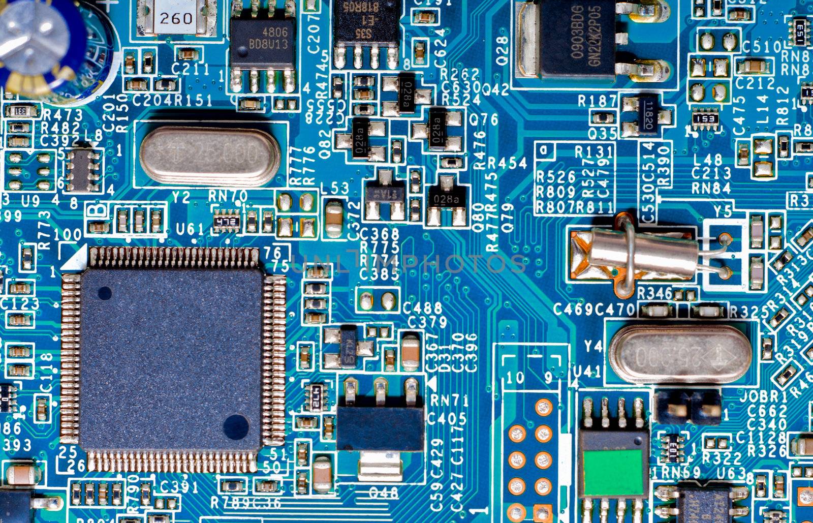 Close-up photograph of a blue circuit board by timh