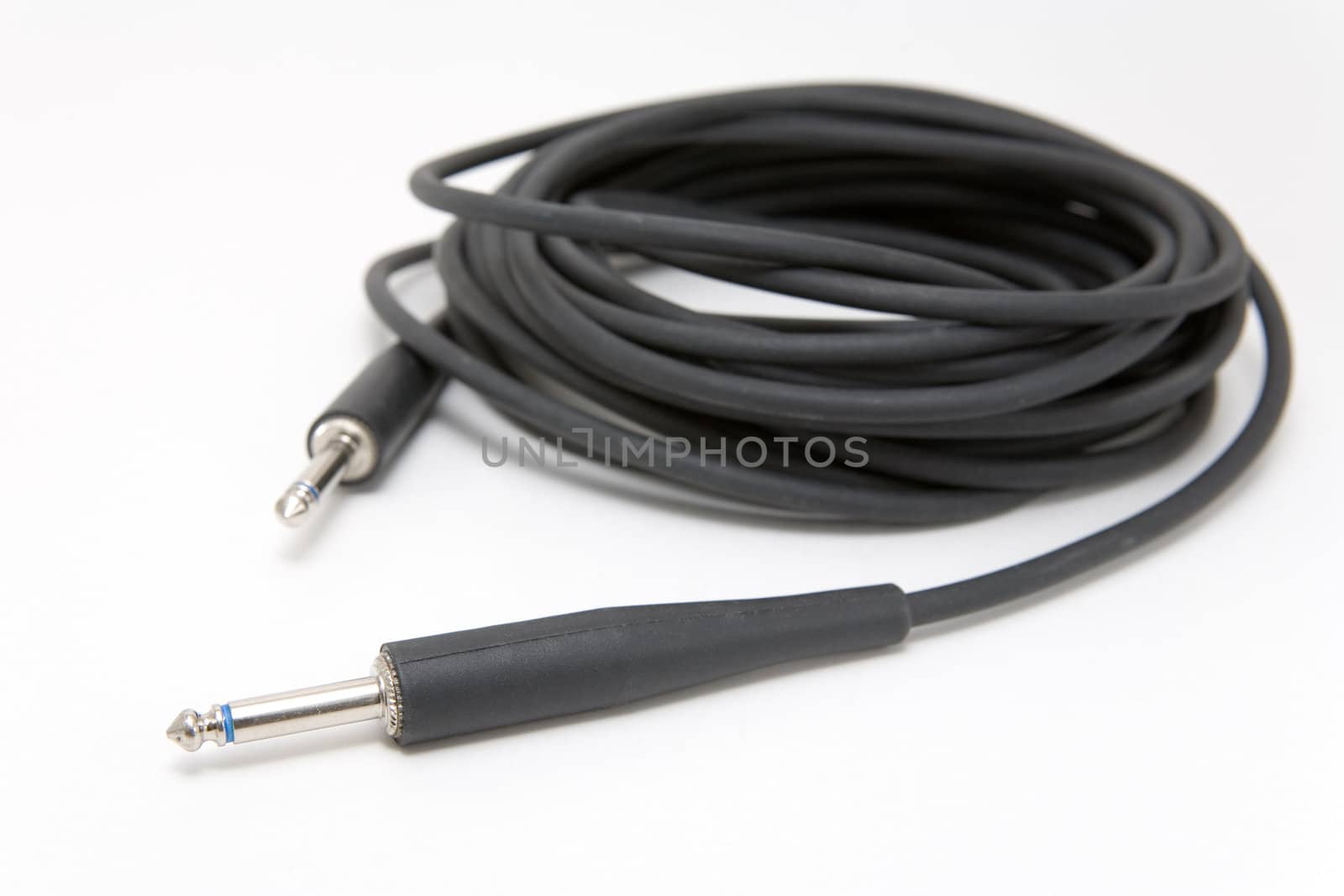 Guitar cable on a white background