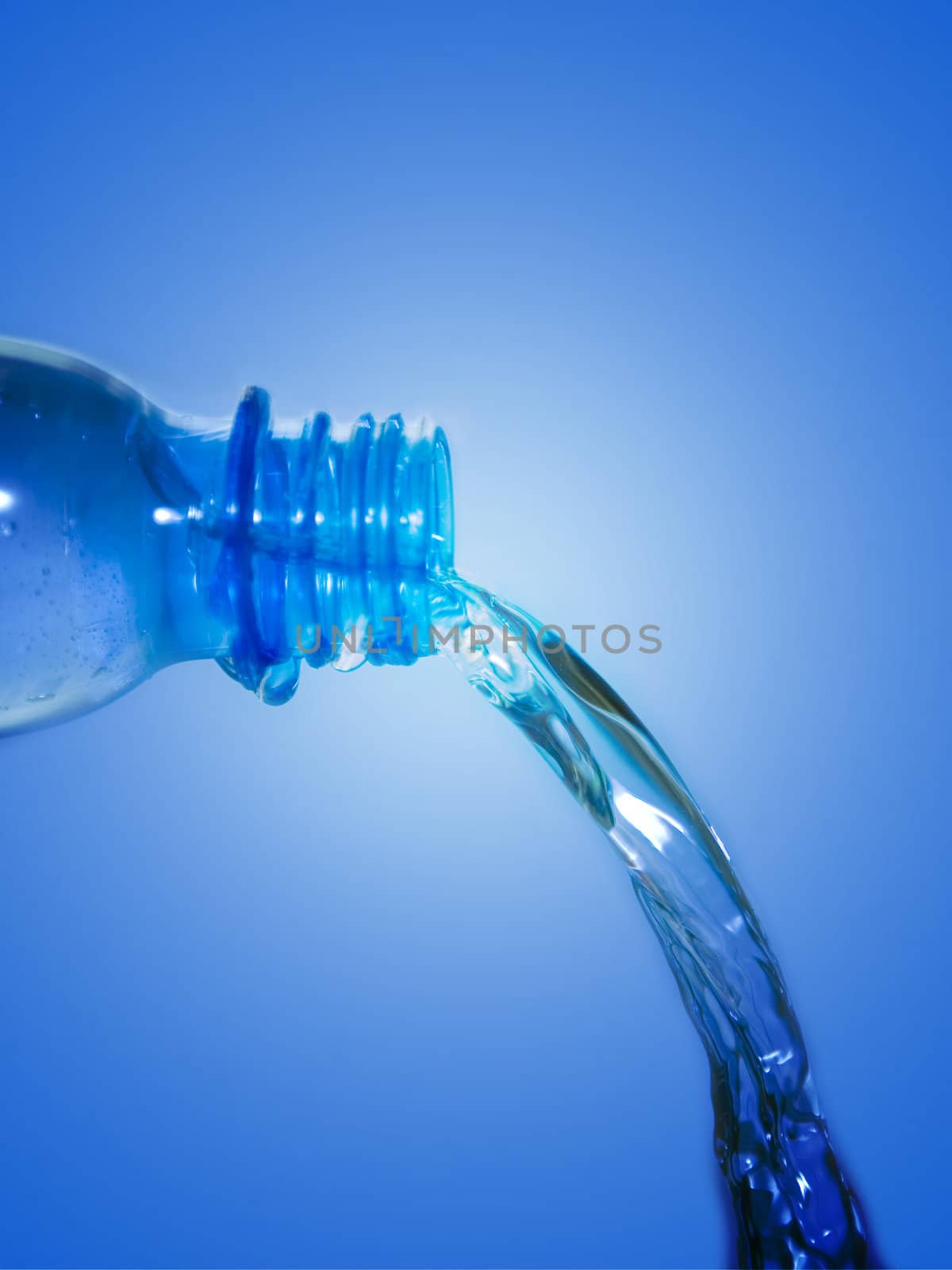 Water poured from a plastic bottle