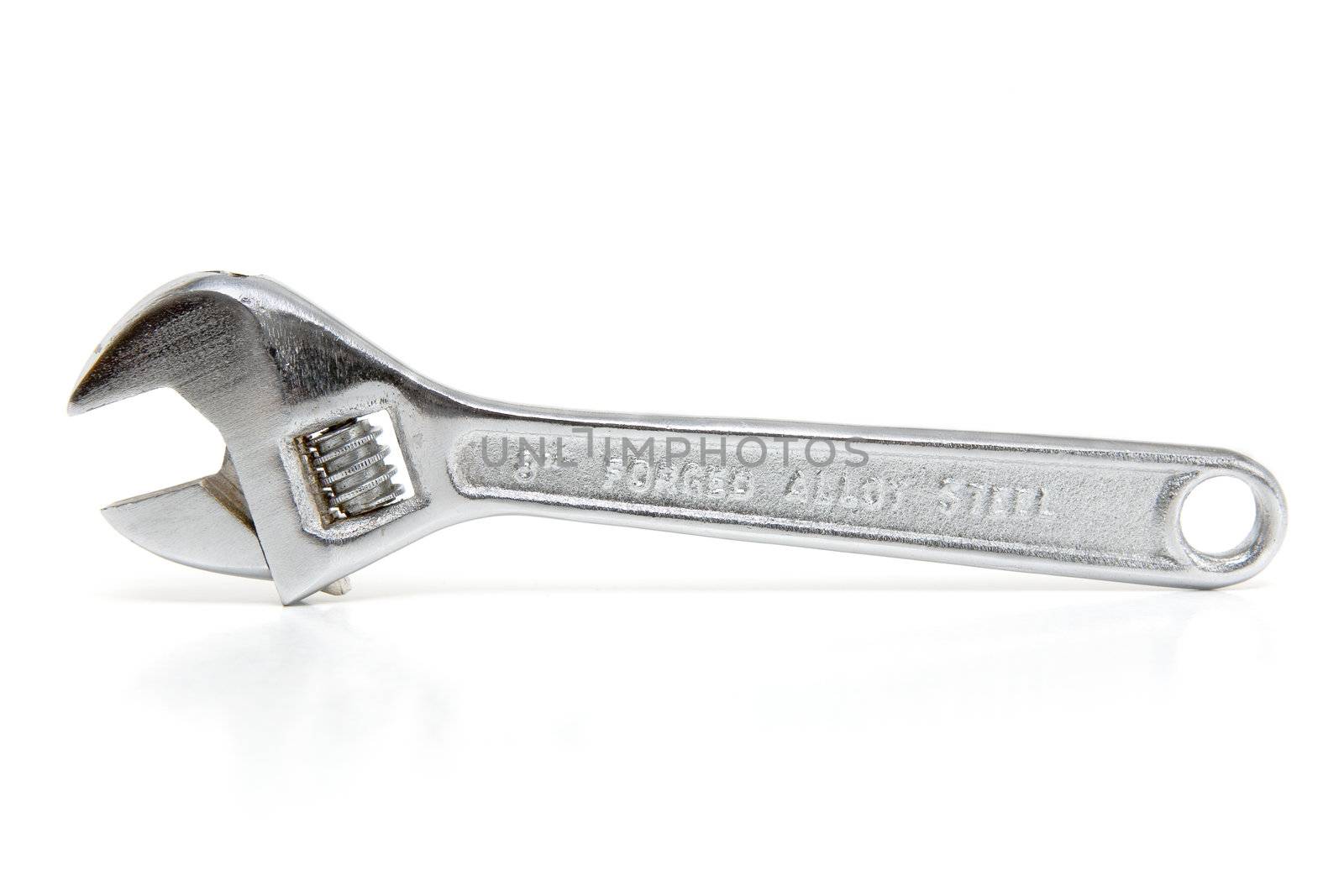 Adjustable wrench on a white background