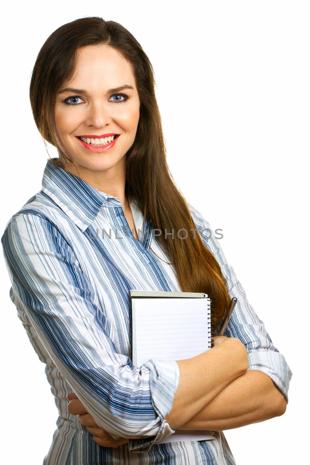 A portrait of a beautiful confident business woman smiling and holding a note pad and pen. Isolated over white.
