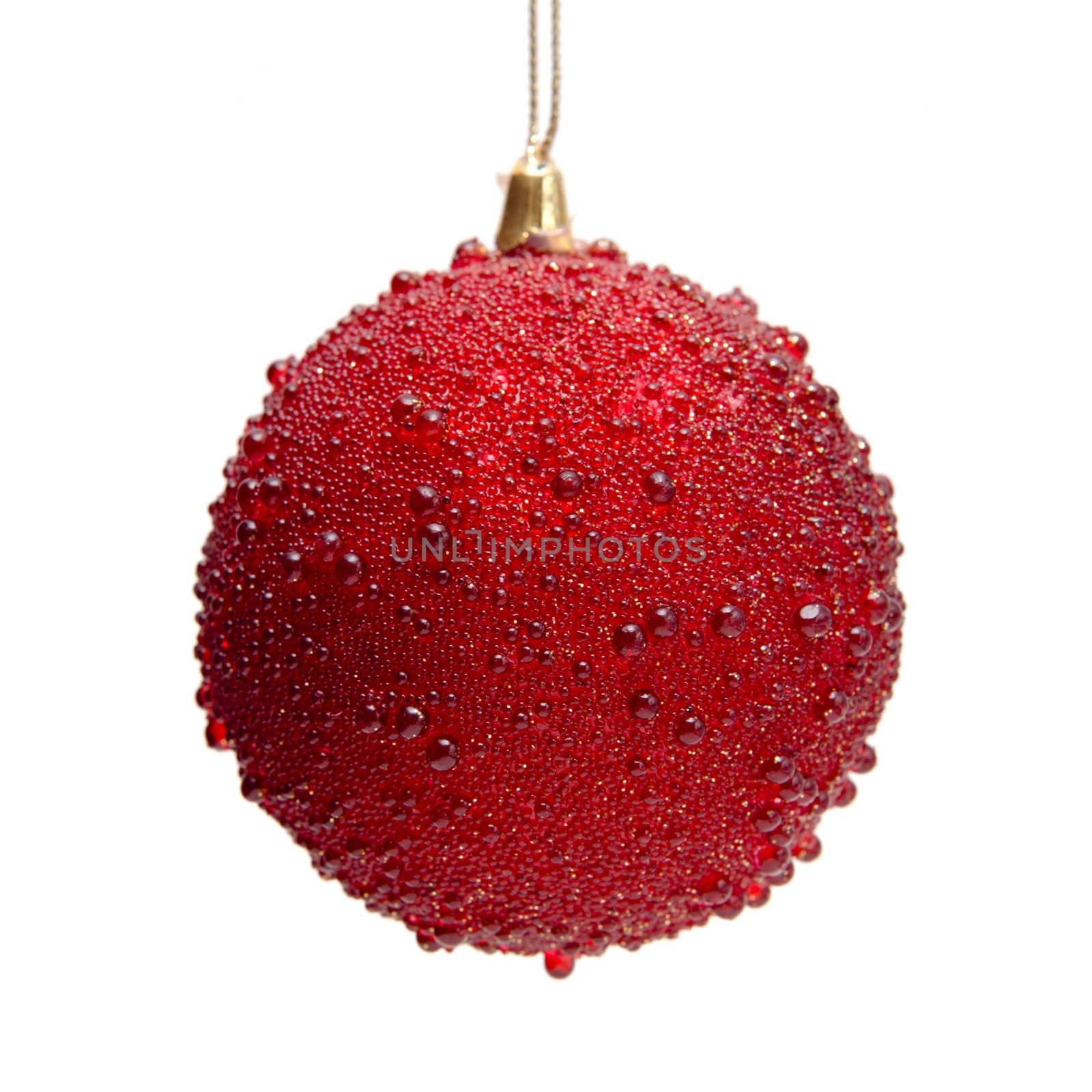 Red christmas bauble hanging in isolation