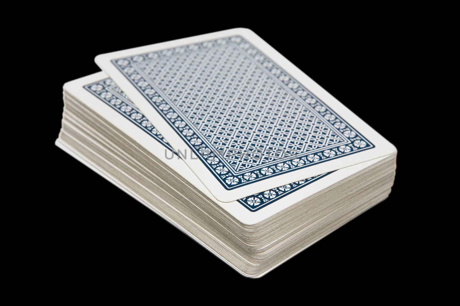 Pack of playing cards isolated over black