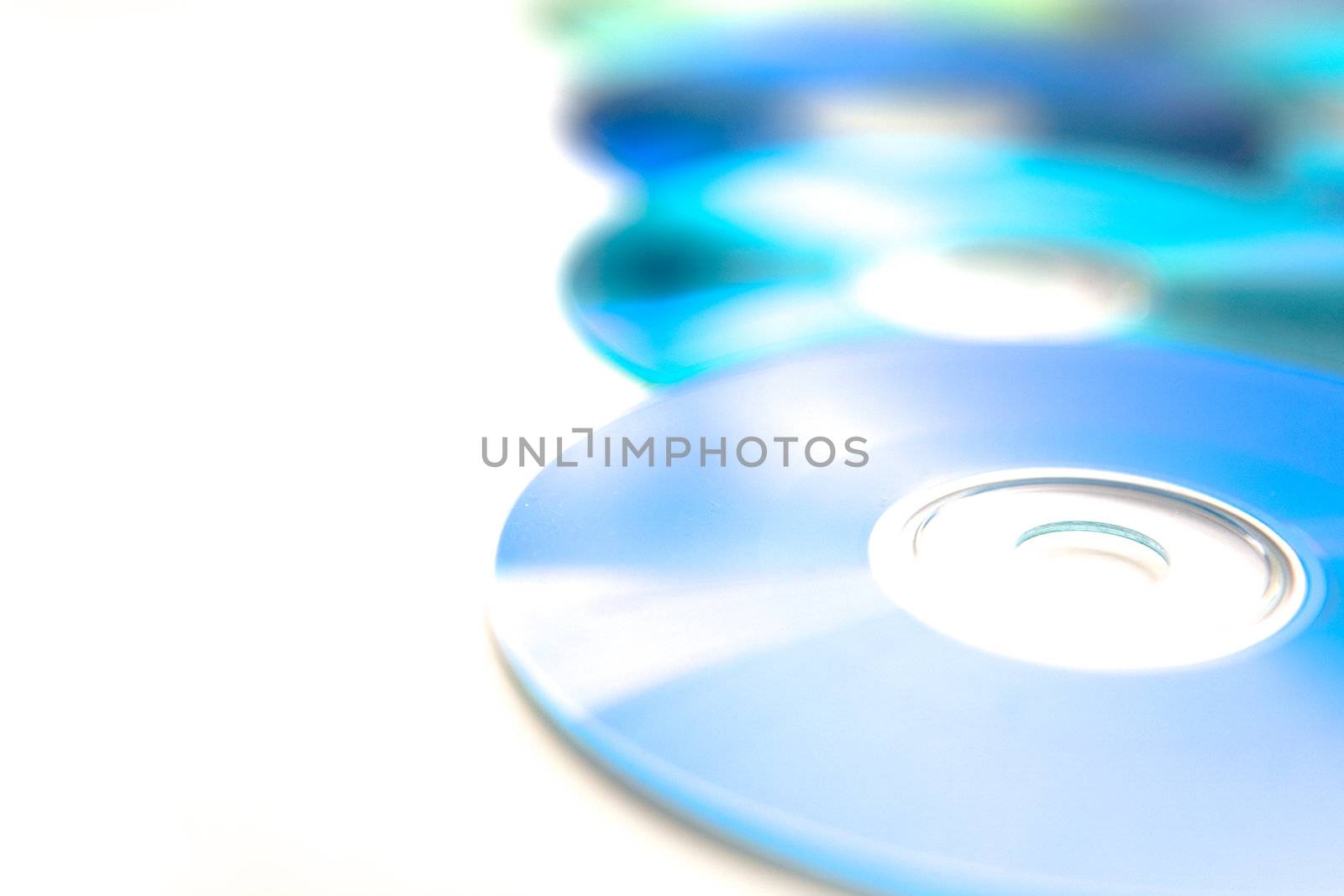 Recordable compact discs in an array - overexposed for graphical effect