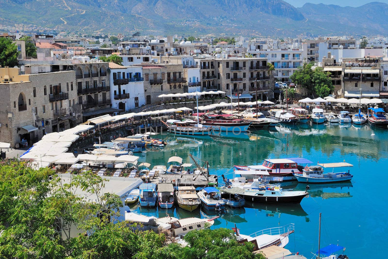 Seashore with a pier. Tourist center of Kyrenia, Cyprus.