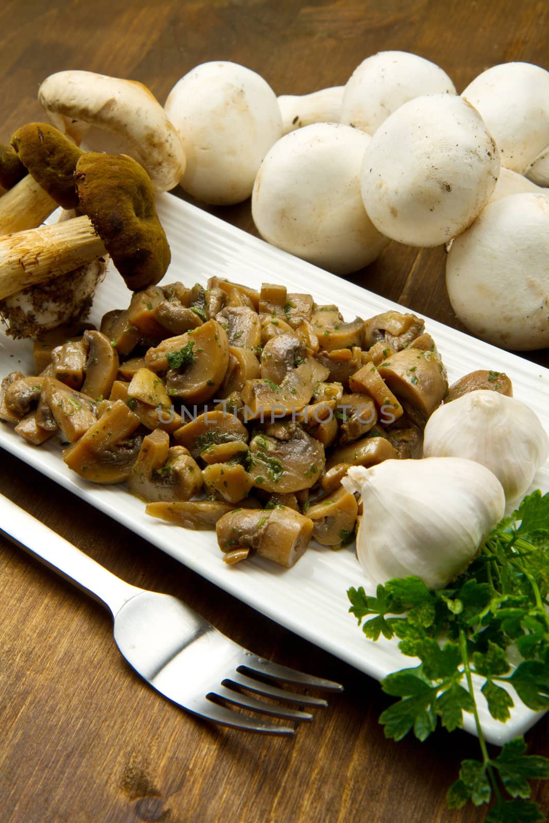 cooked and fresh mushrooms  with garlic and parsley