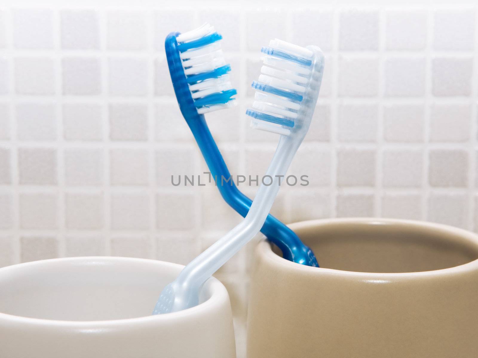 Her toothbrush and his toothbrush