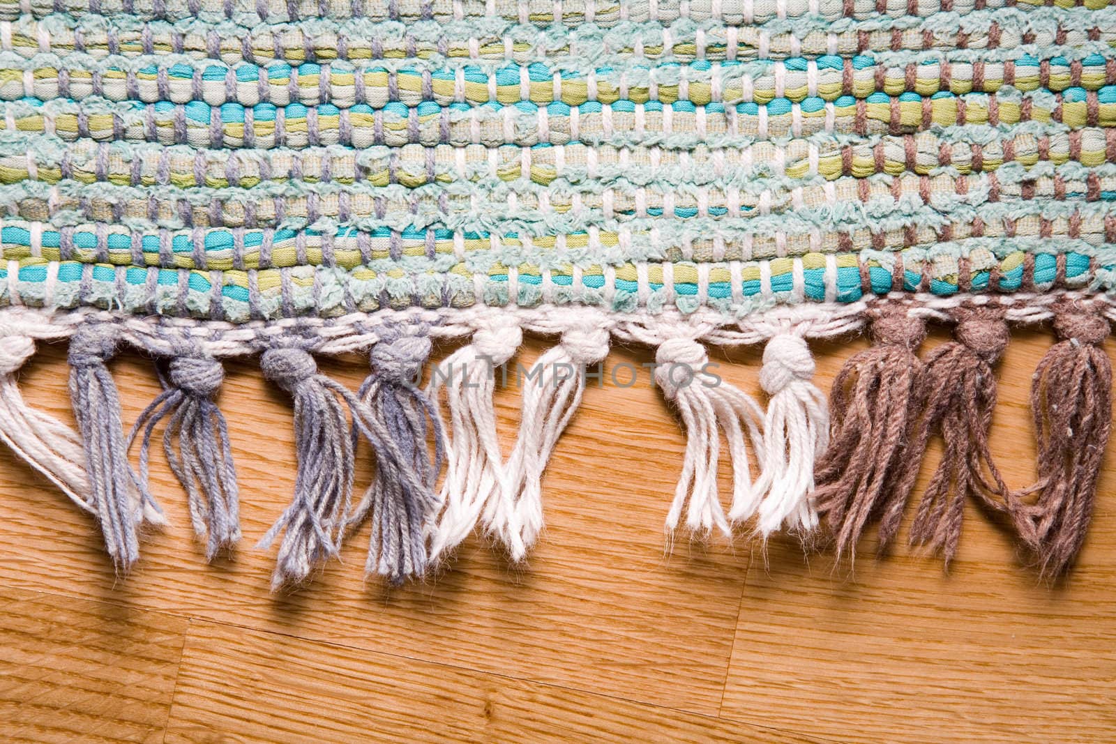 Woven carpet on a parquet floor