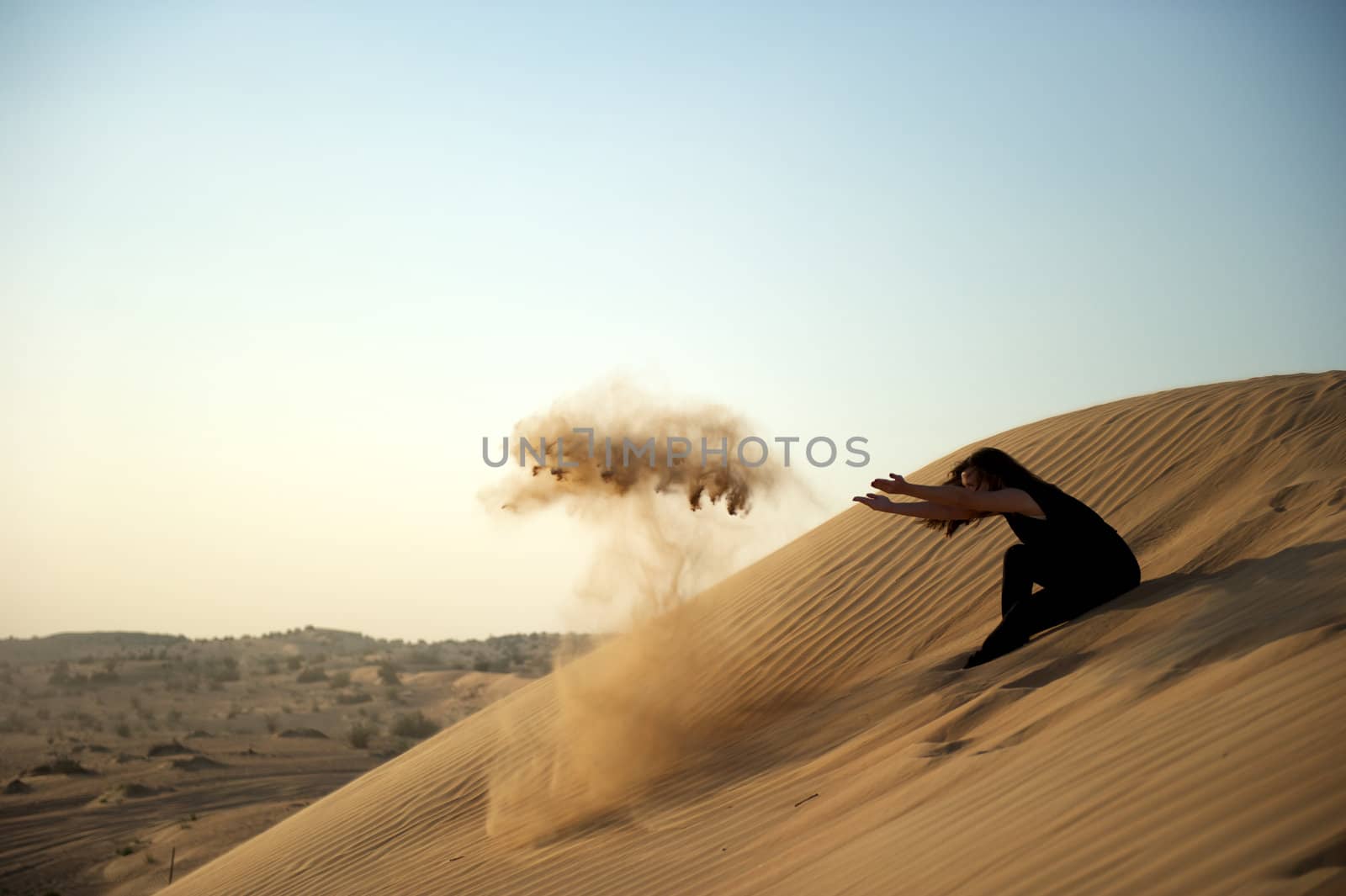 Woman enjoying the desert in Dubai, United Arab Emirates