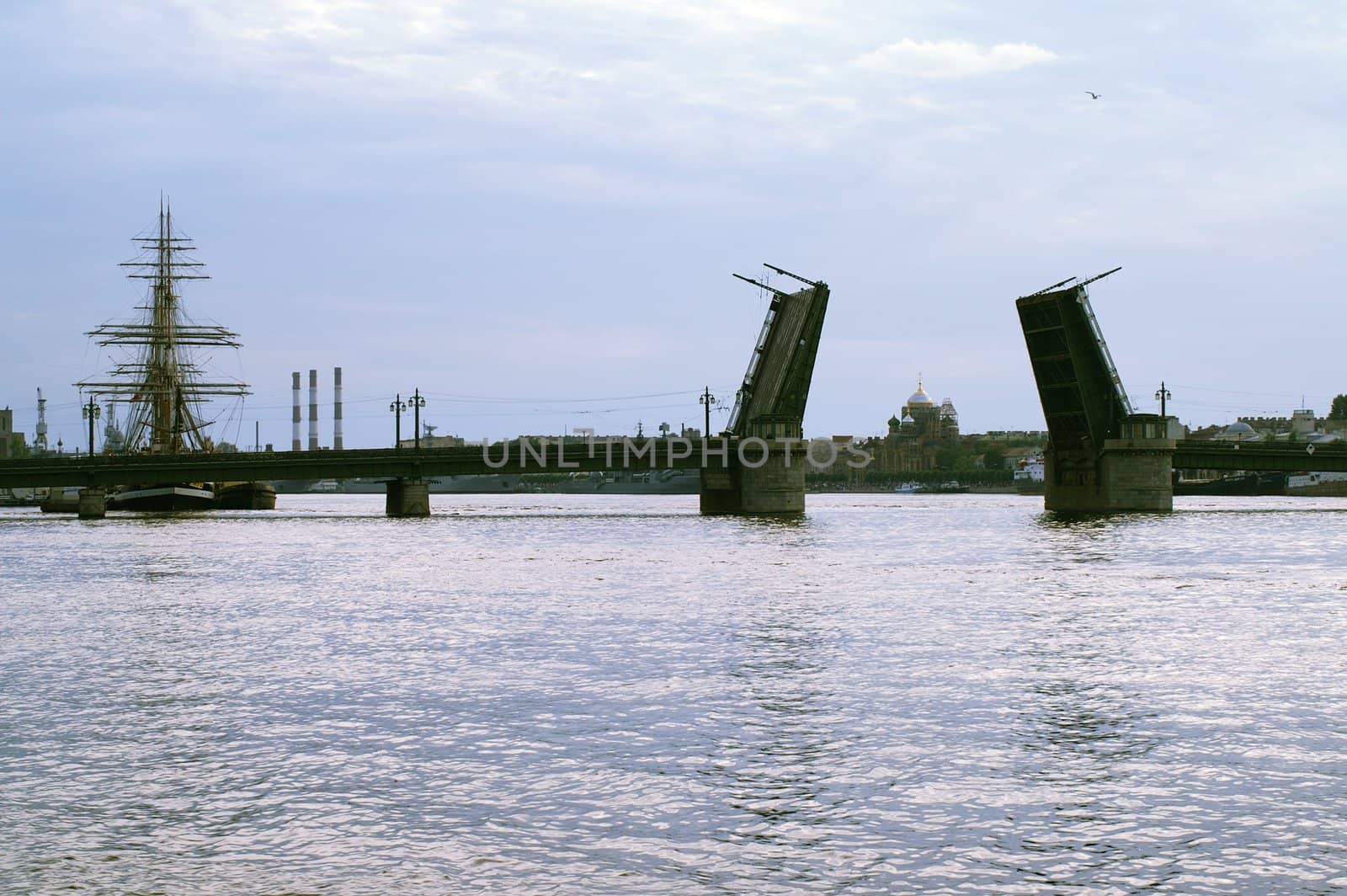 Raised Schmidt's Drawbridge over Neva river at Dusk in Saint Petersburg, Russia