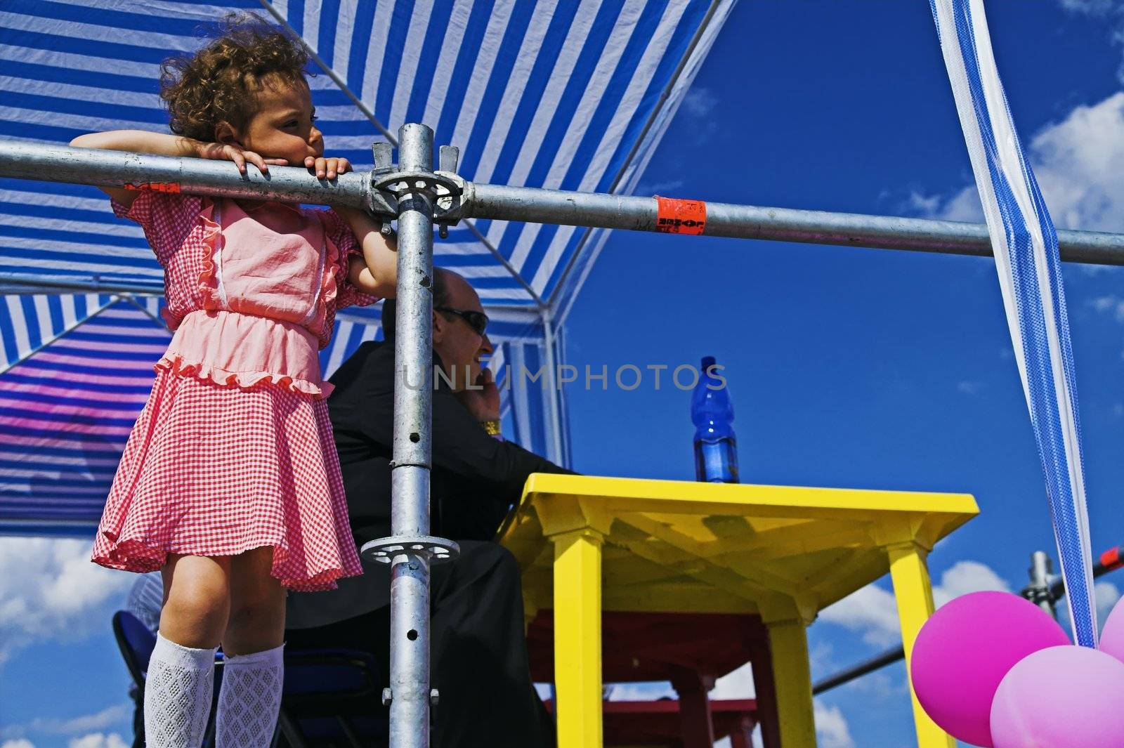 ST PETERSBURG - JUNE 28: Girl, 8, looks at carnival procession at Life in Pink festival June 28, 2008 in St Petersburg, Russia.