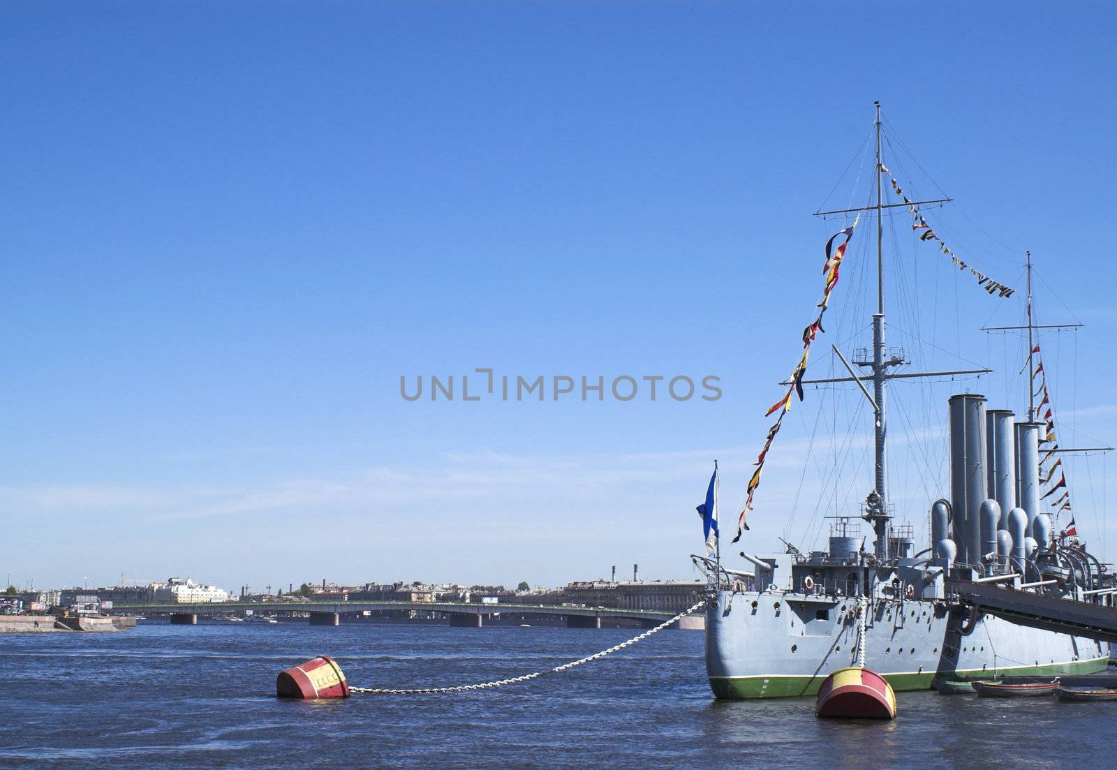 The stern part of famous cruiser Aurora (relating to the Russian October 1917 revolution) now docked for ever as a museum at Petrogradskaya embankment opposite the Nakhimovskoi Naval School in Saint Petersburg. (The ship name is erased in the image.)