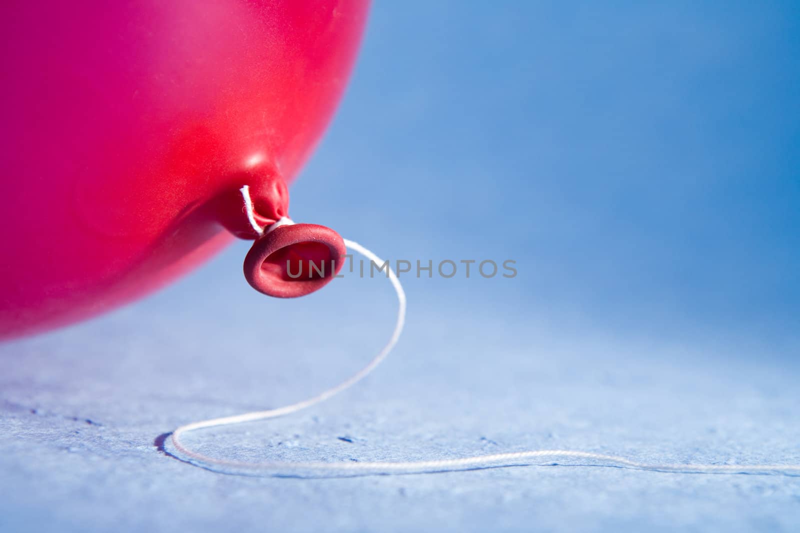 Red balloon with a thread