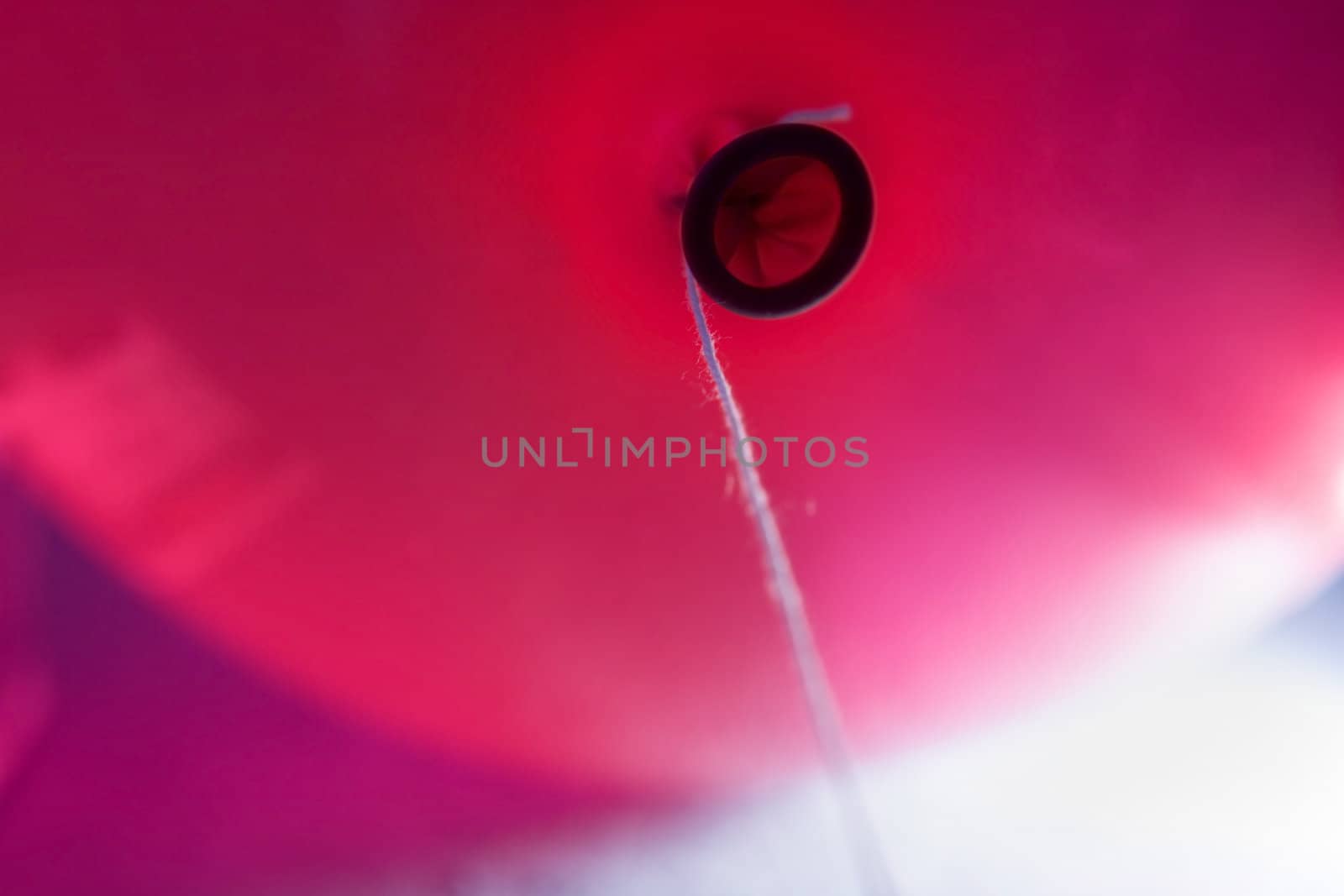 Red balloon with a thread