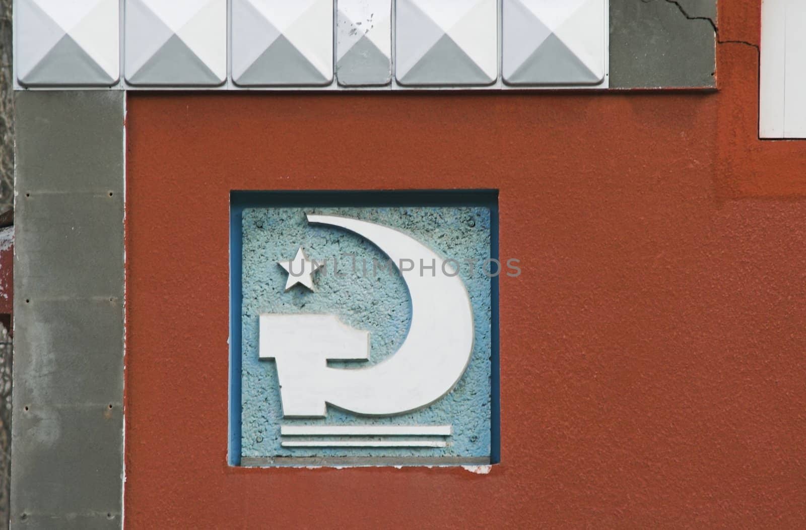Soviet-style decorative detail on a building wall.