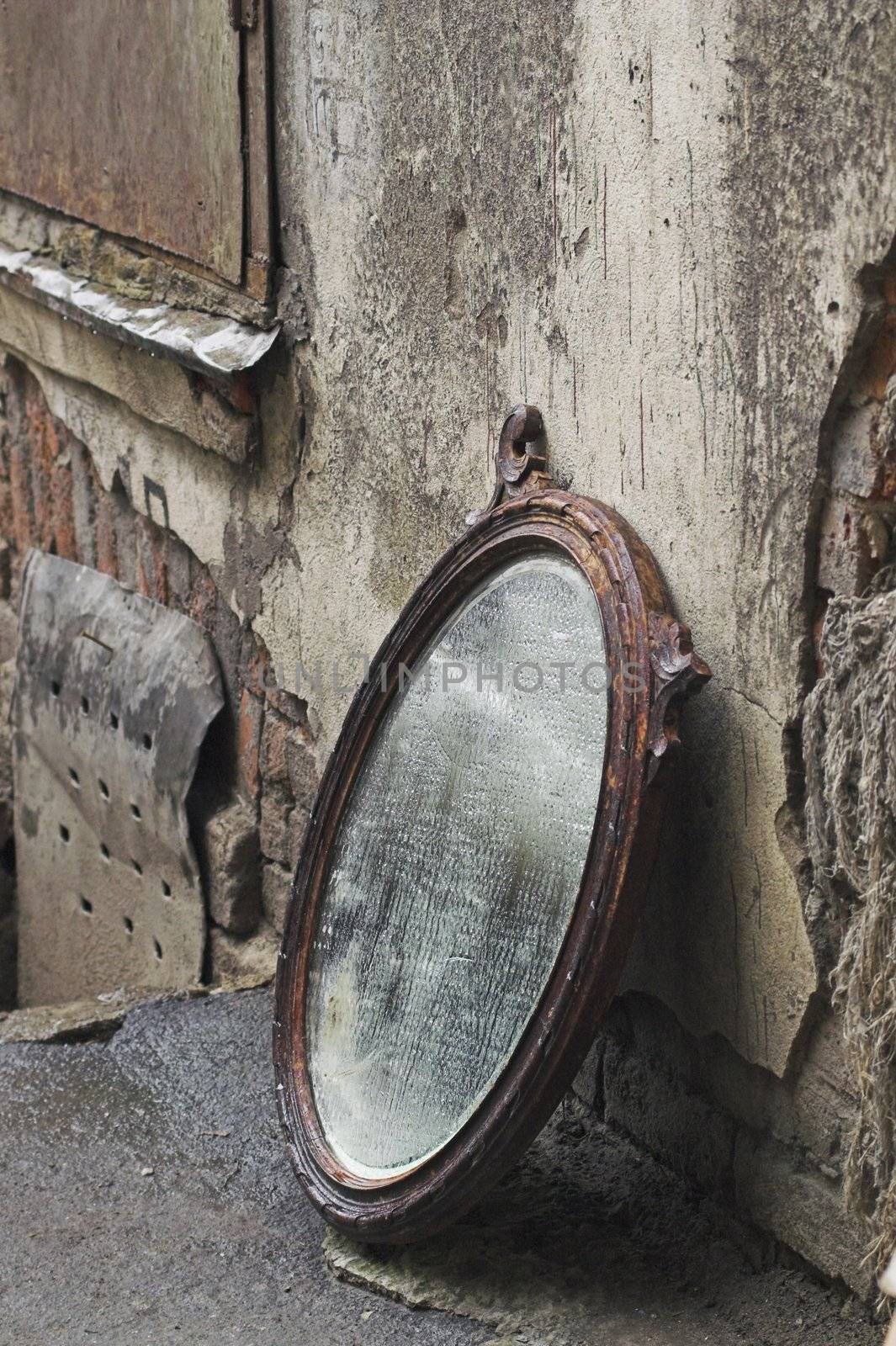 Old Mirror Standing Against Wall