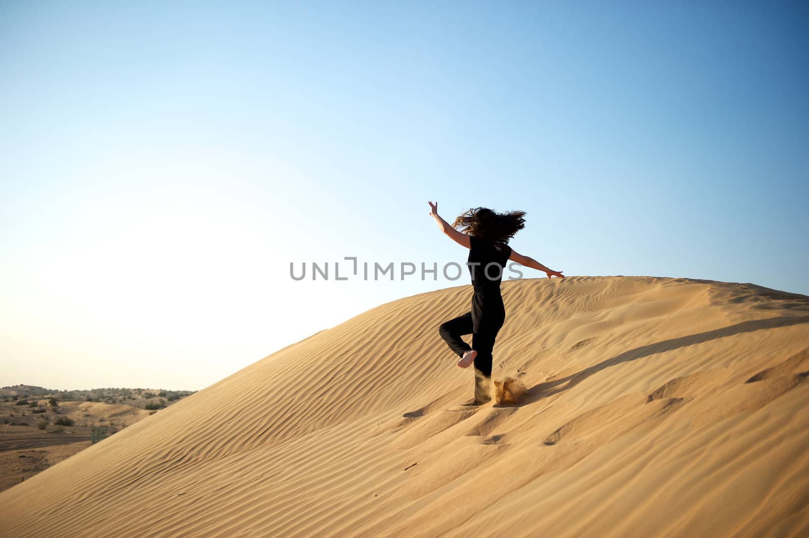 Woman enjoying the desert in Dubai, United Arab Emirates