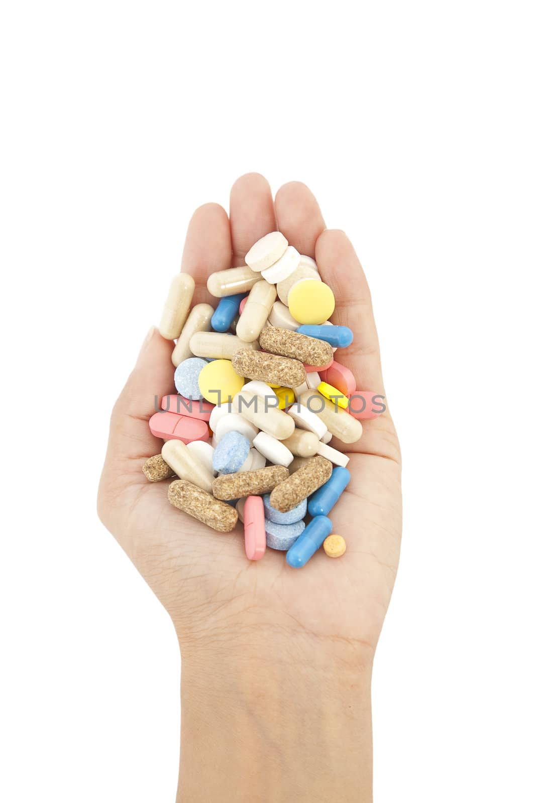 pills in hand isolated on white background
