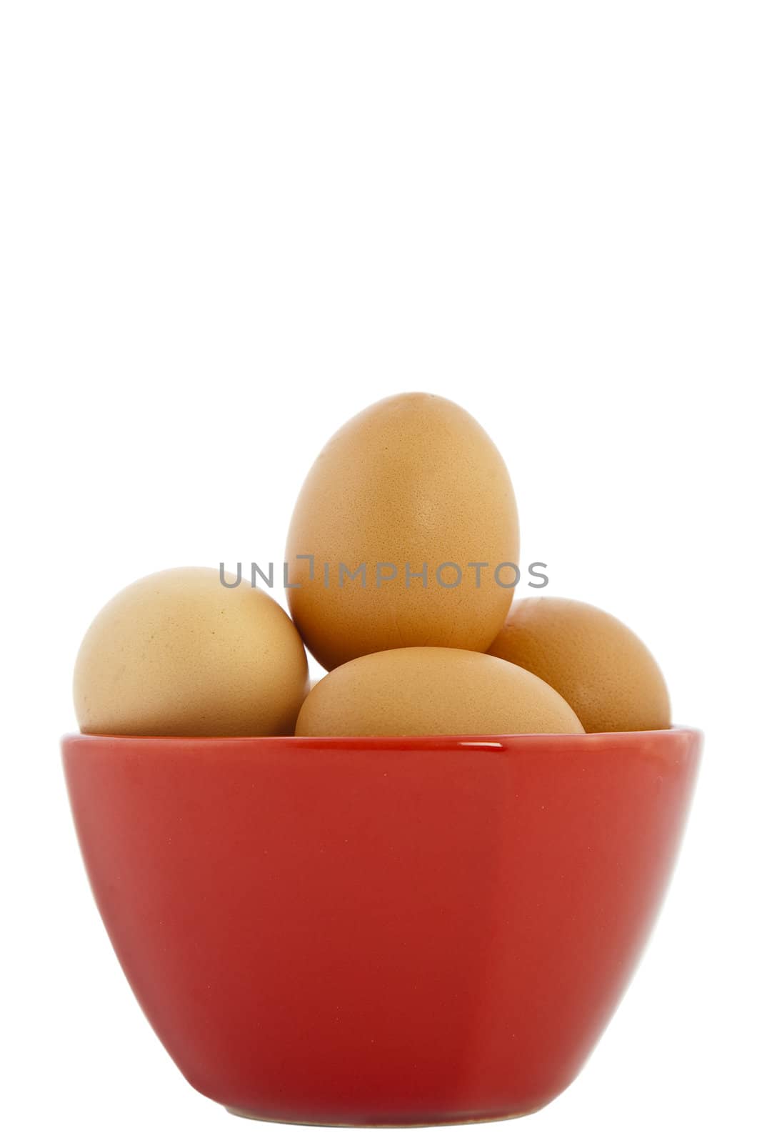 brown eggs in red bowl on white background
