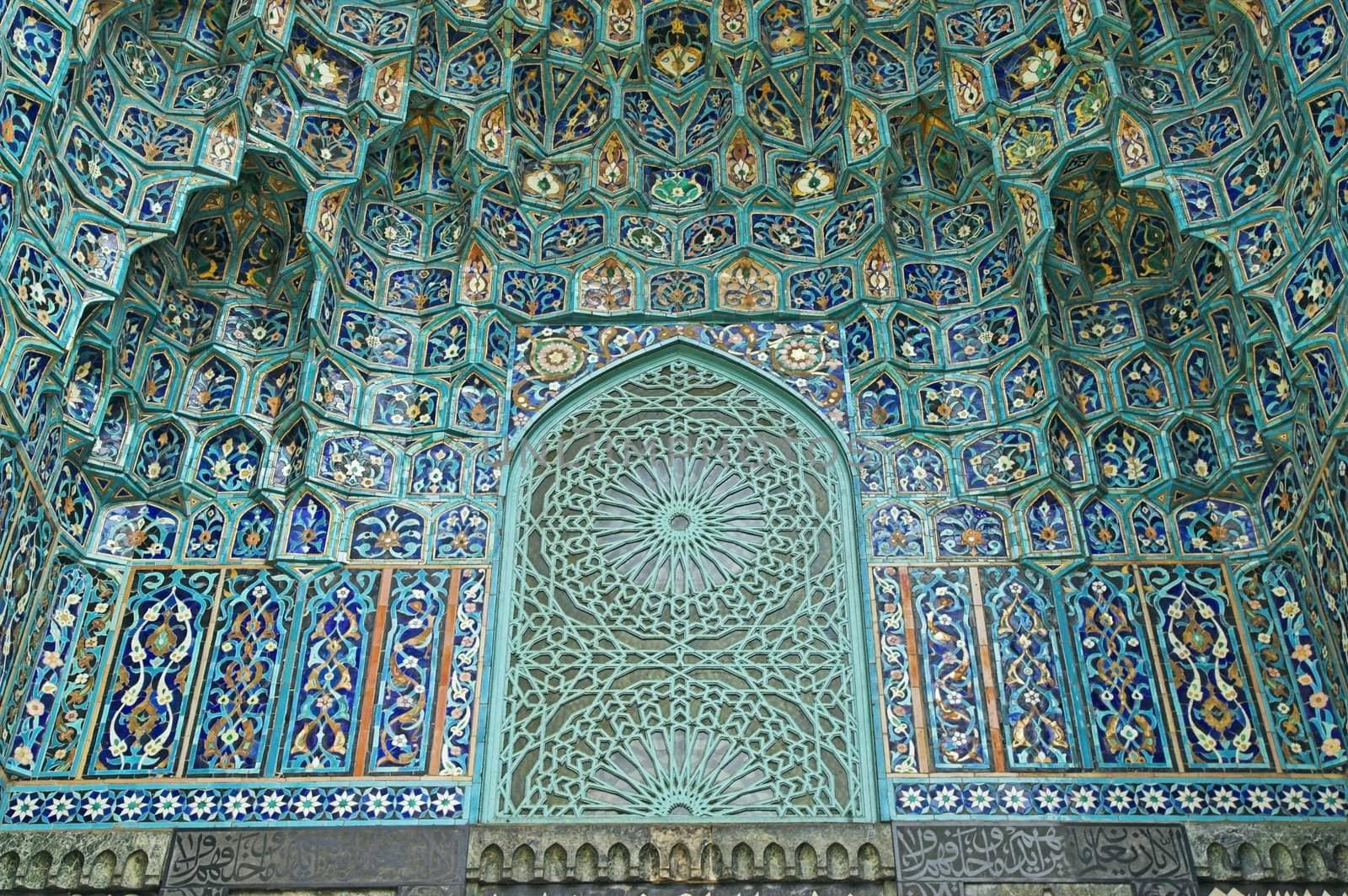 Fragment of a tiled wall with Arabic mosaic of an ancient mosque in Saint Petersburg, Russia.