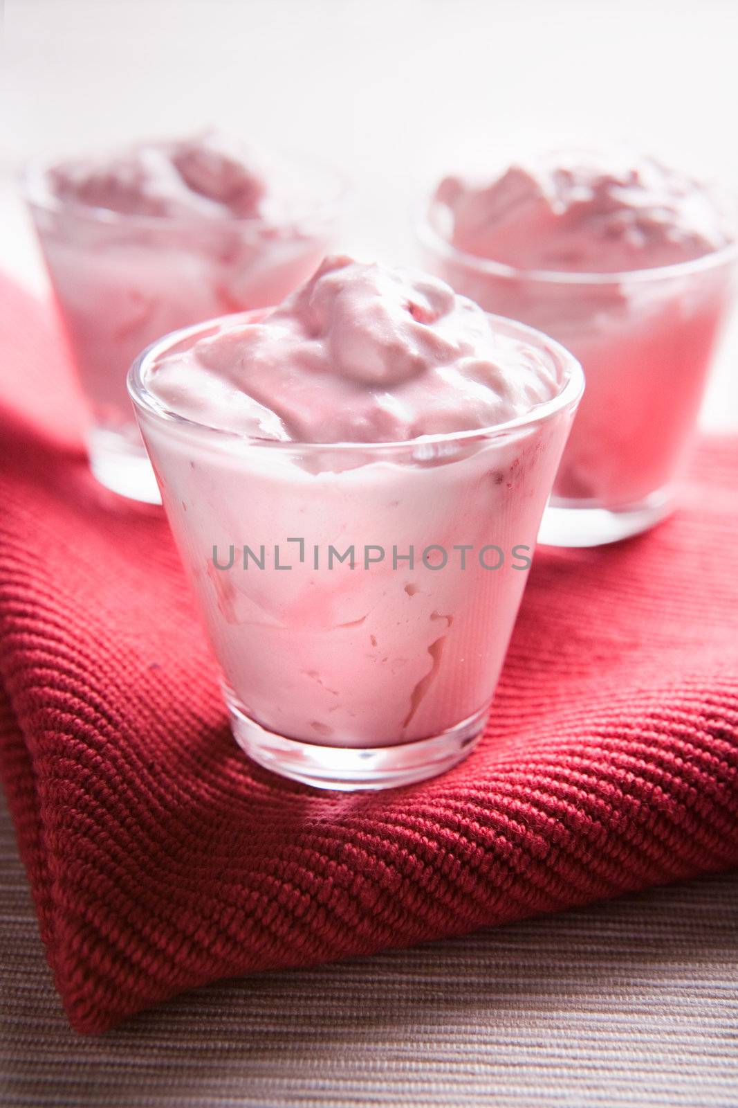 Pudding desserts in small glasses on a table