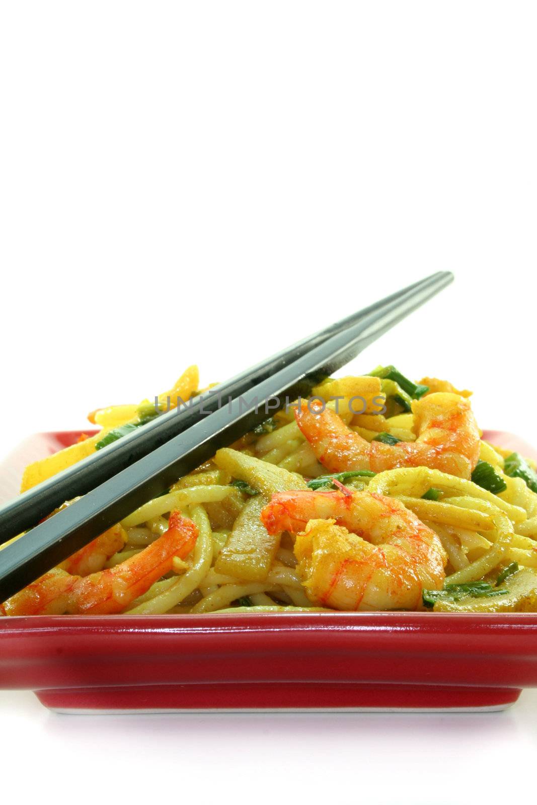 Pasta with asian shrimp in asian dishes