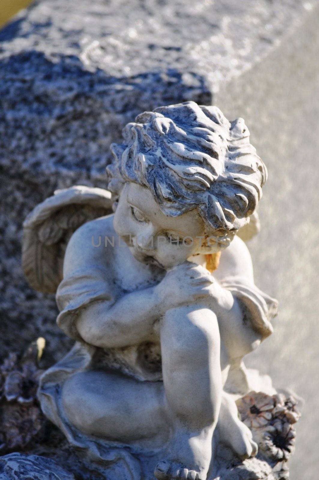 Gravesite - Angel on tombstone close up by RefocusPhoto