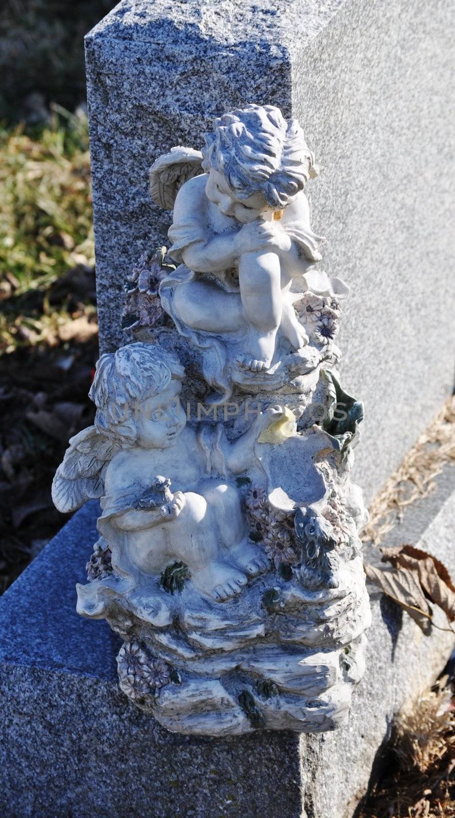 Gravesite - Angels on tombstone by RefocusPhoto