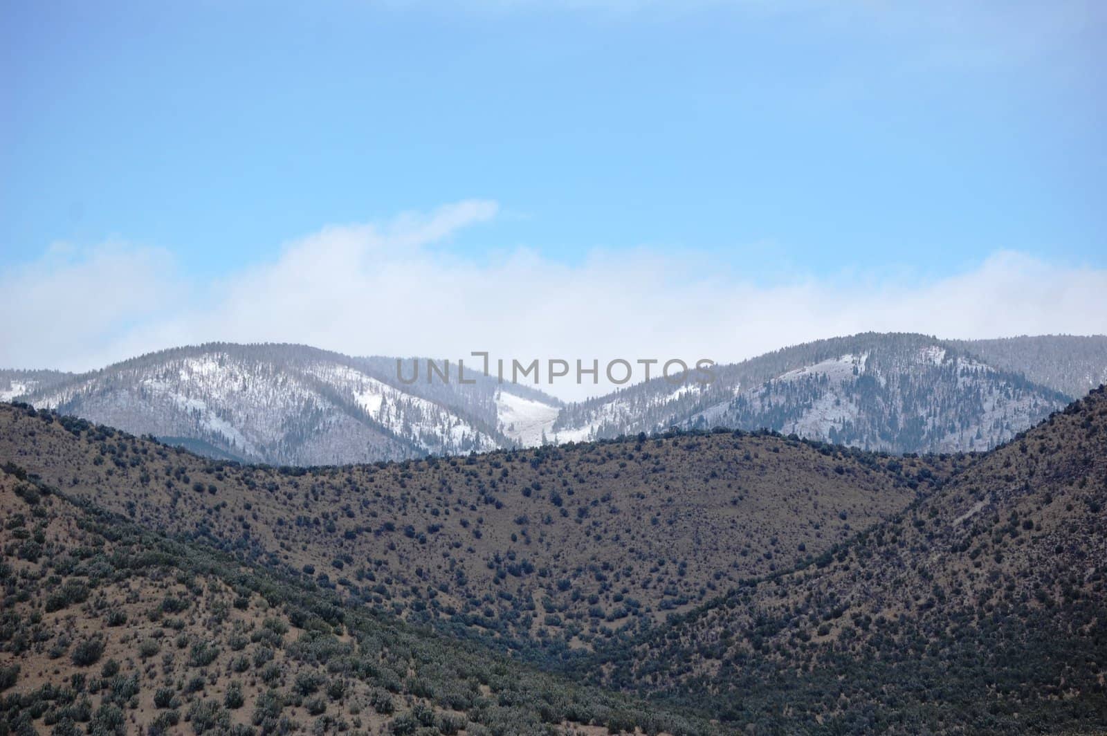 Rolling mountain hills with clouds by RefocusPhoto