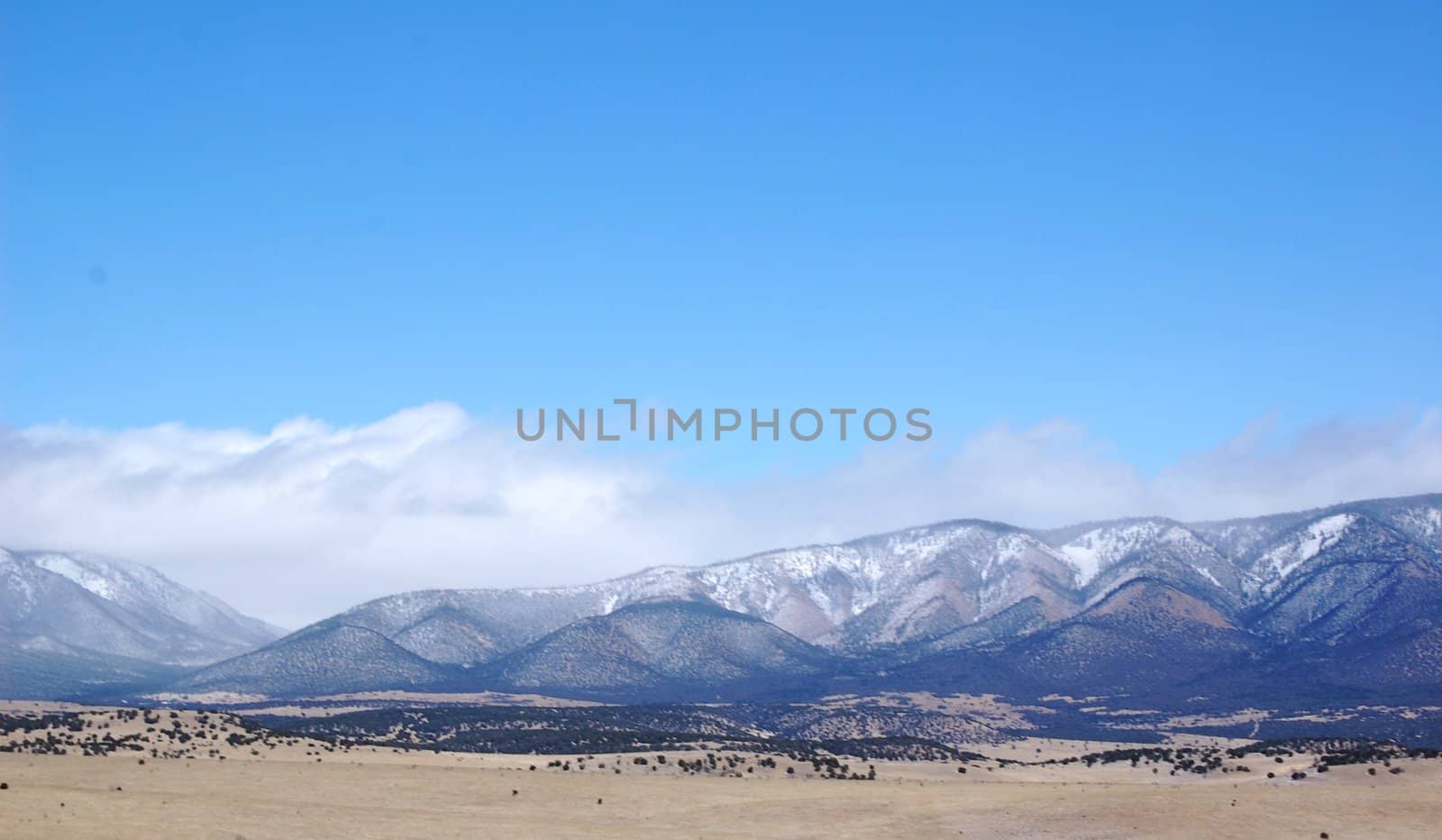 Rolling mountain hills with clouds by RefocusPhoto