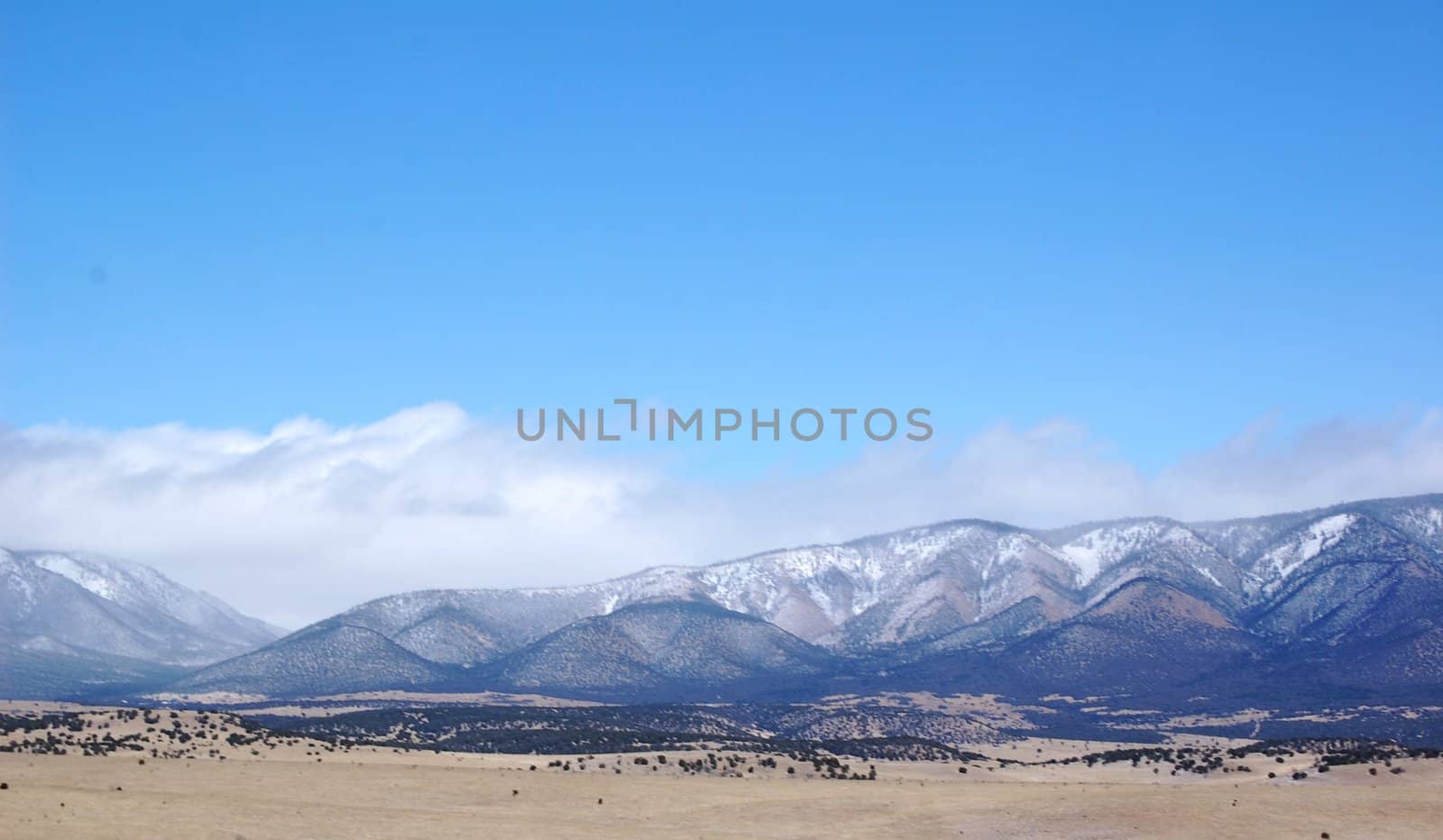 Rolling mountain hills with clouds