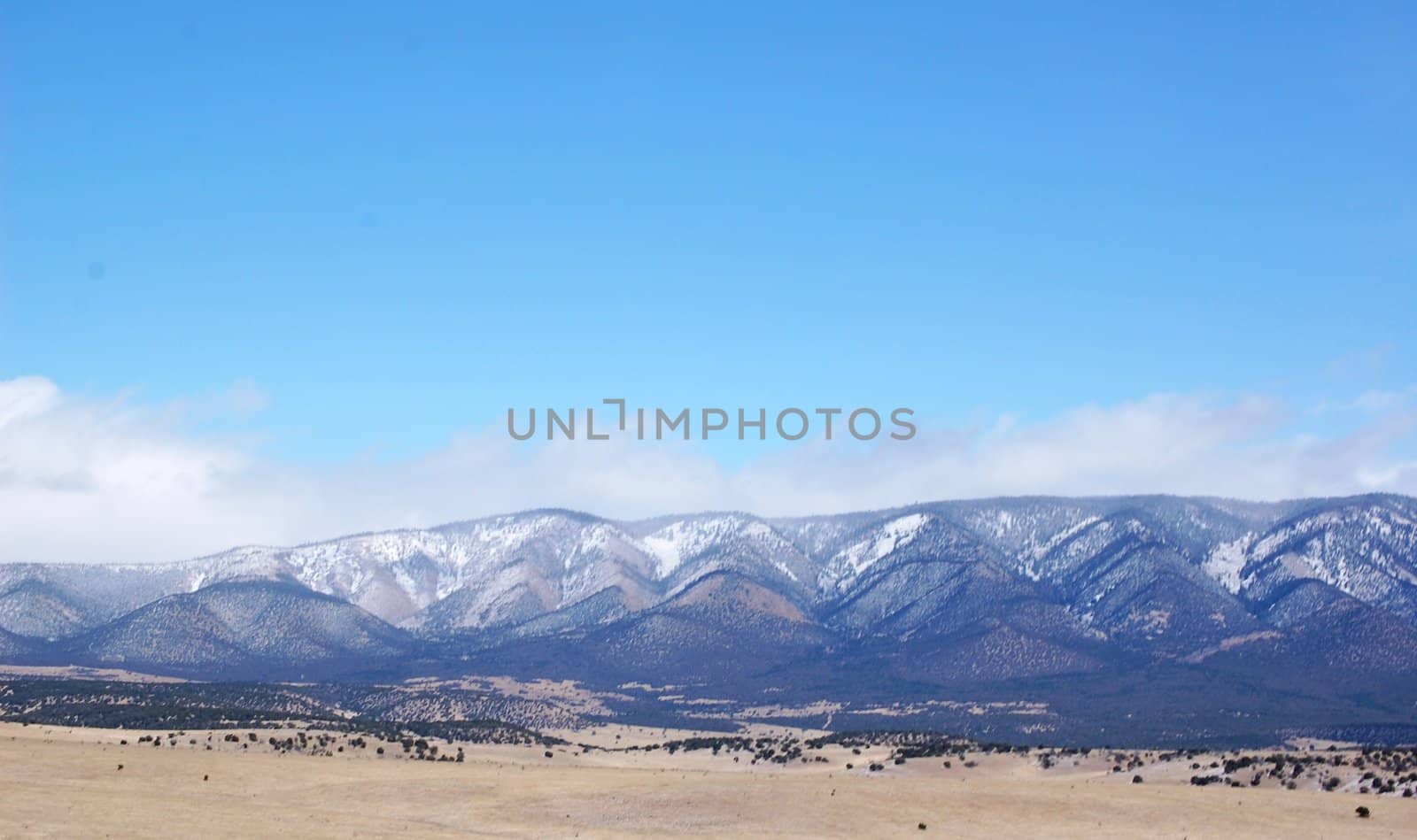 Rolling mountain hills with clouds