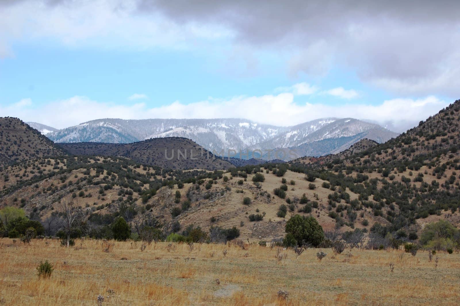 Rolling mountain hills with clouds