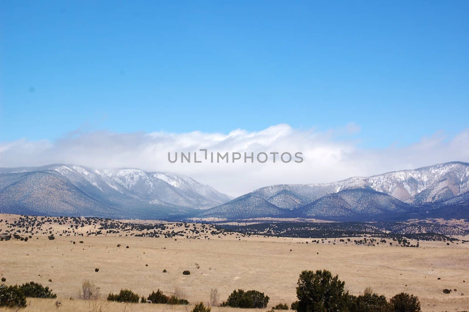 Rolling mountain hills with clouds