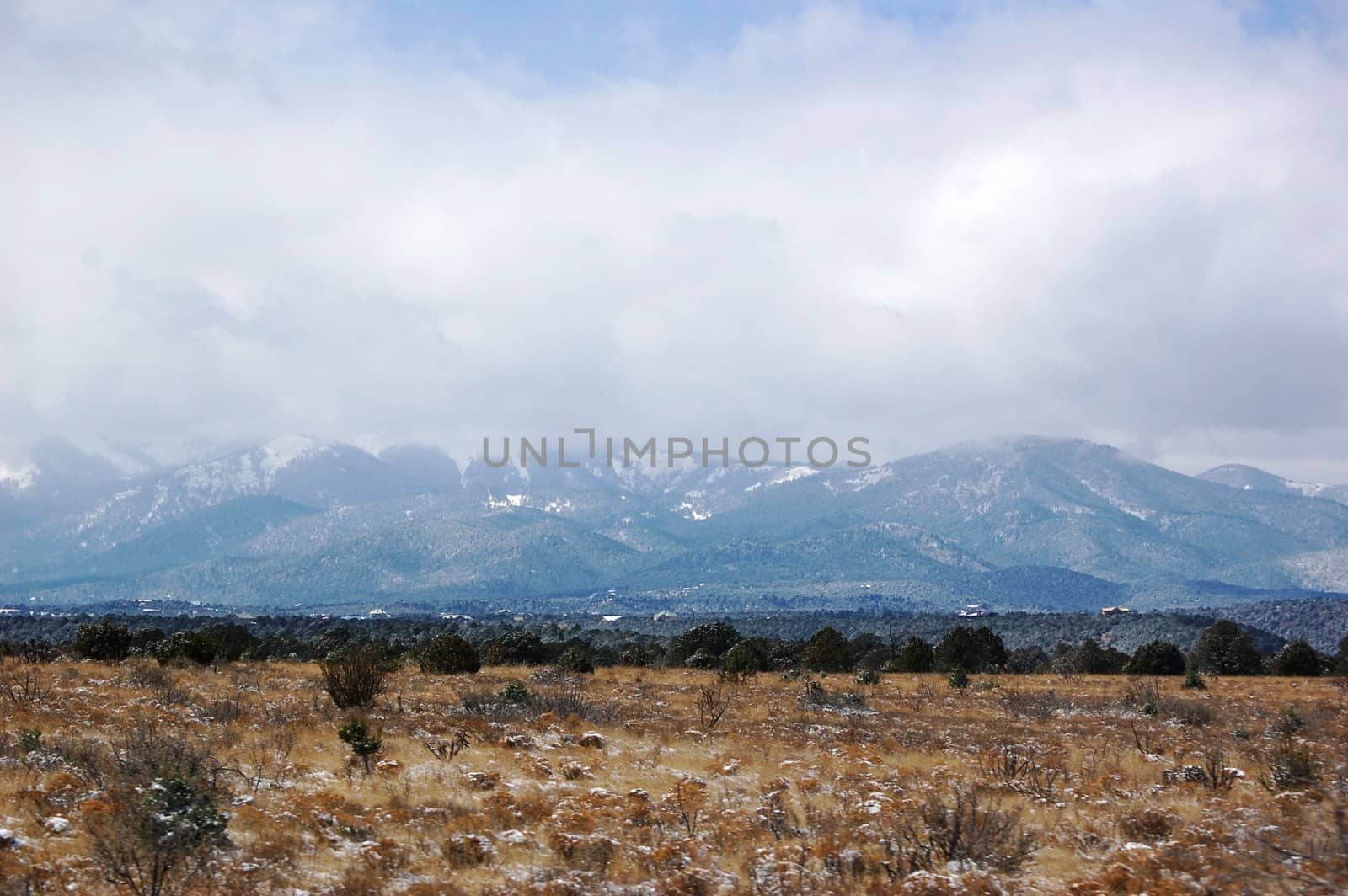 Rolling mountain hills with clouds by RefocusPhoto