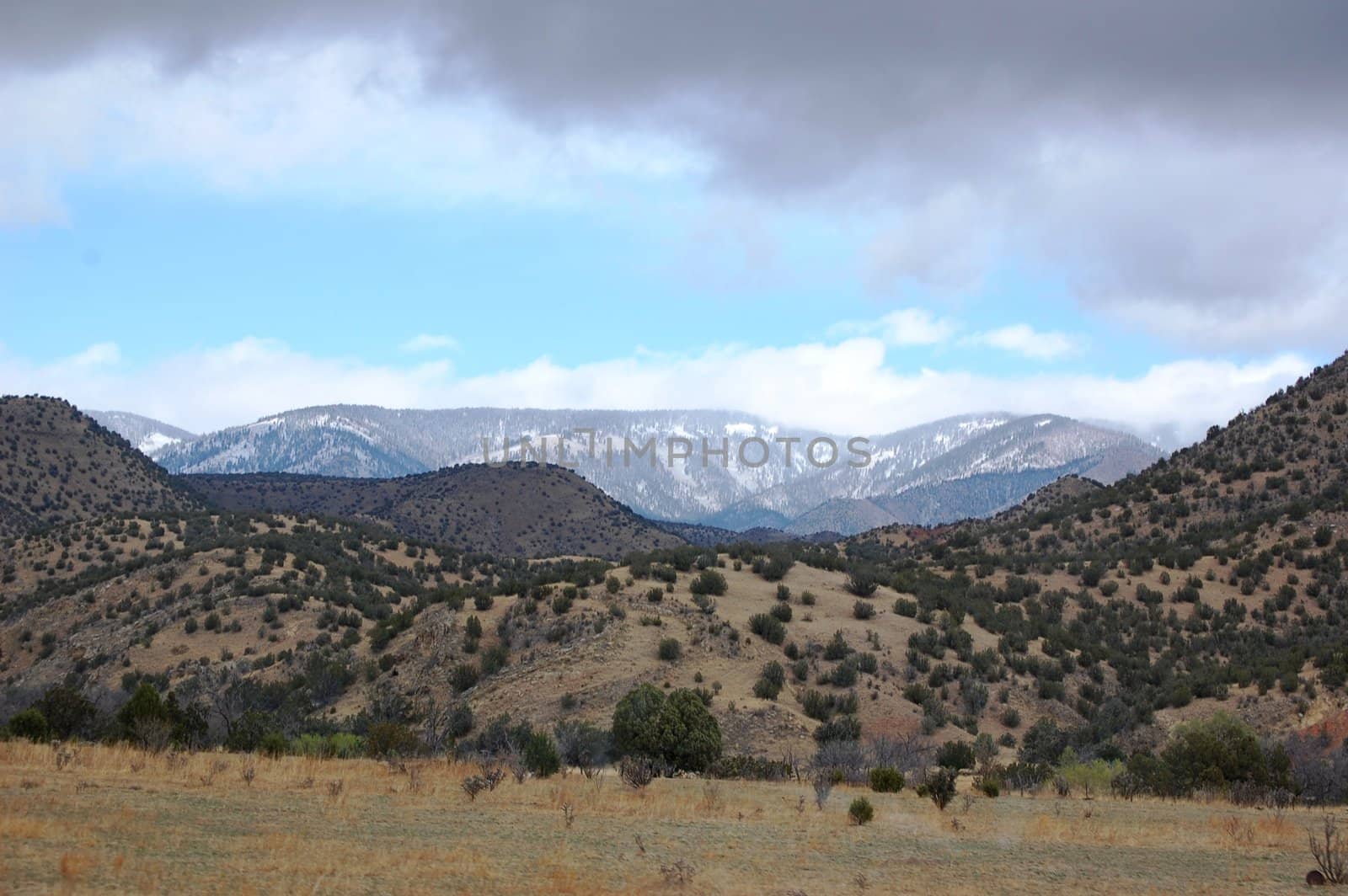 Rolling mountain hills with clouds