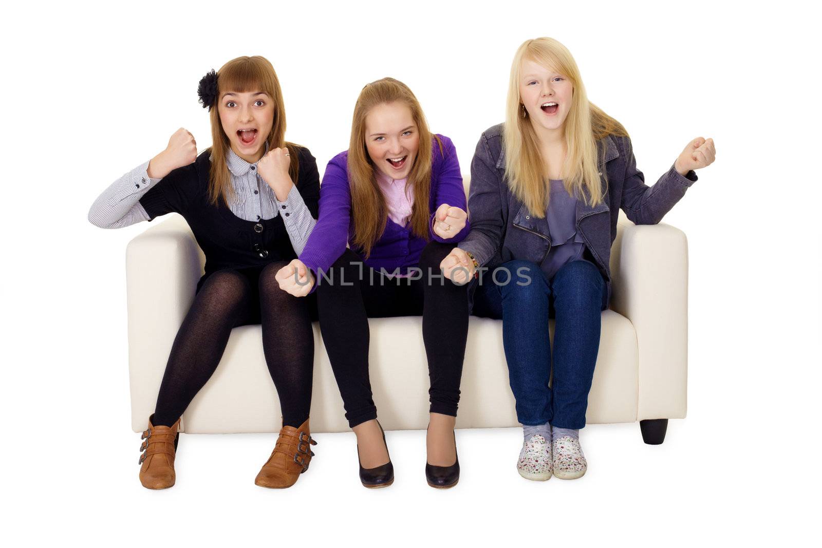 Jubilant young woman on a sofa on a white background