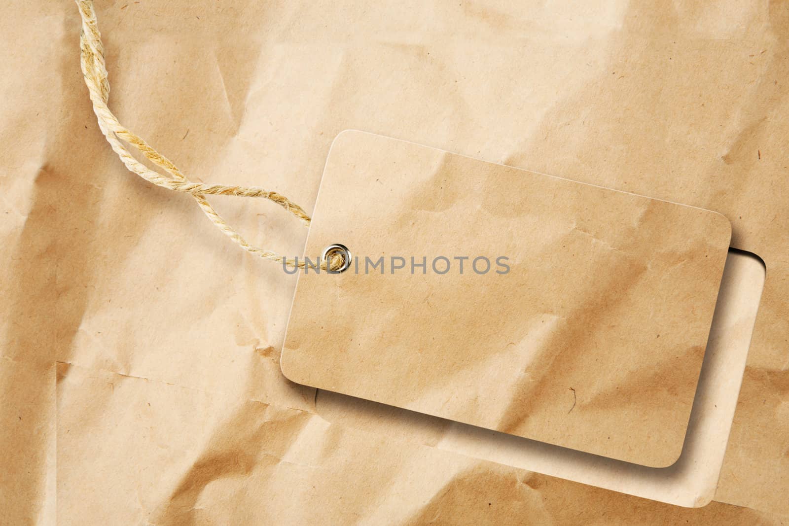 Blank tag cut out from brown paper