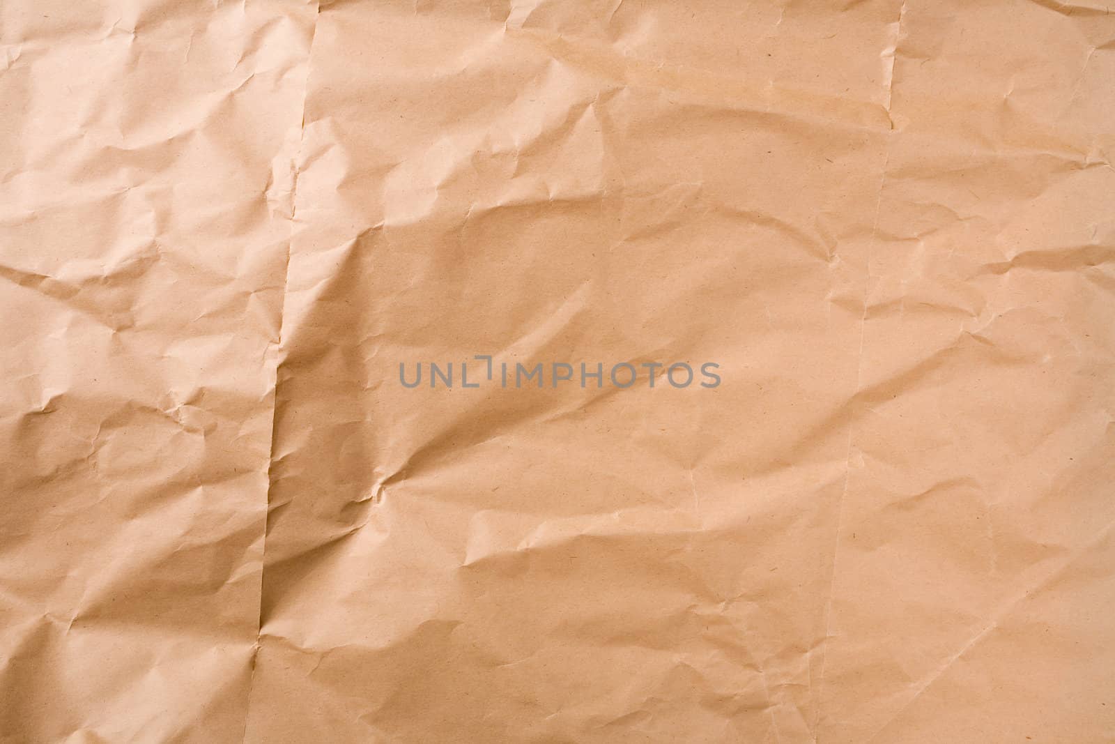 Creased brown packaging paper sheet texture background