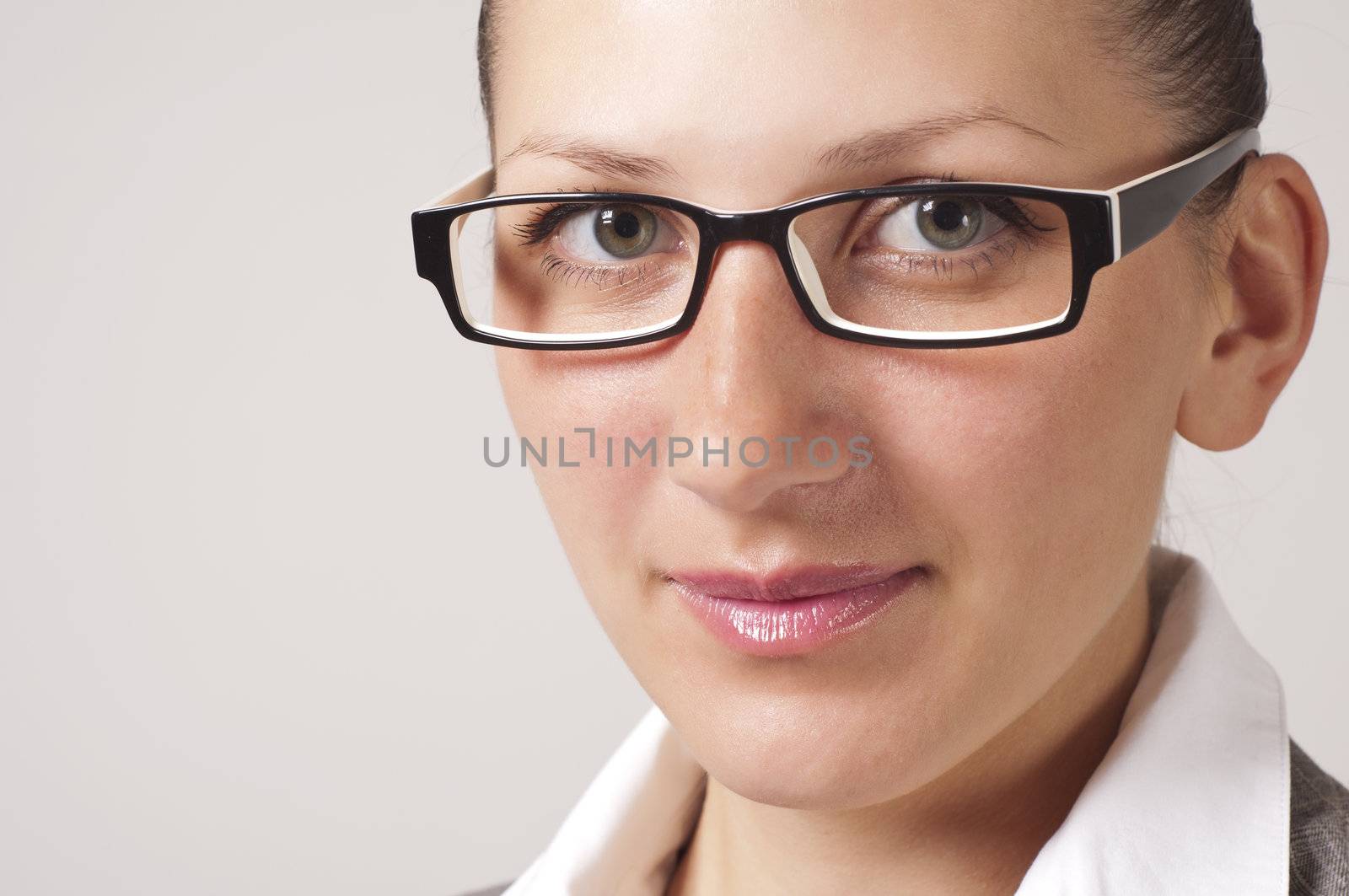 portrait of young business woman in the glasses by adam121